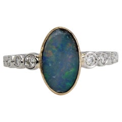 Anello con opale australiano da 1ct, 11x7mm e diamanti naturali in oro bianco e giallo 14K