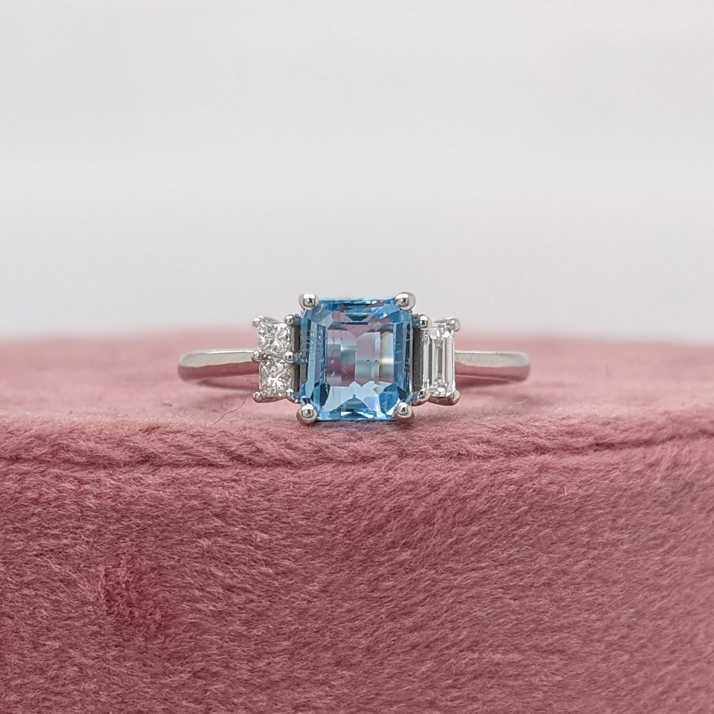 This beautiful ring features a 1.08 carat emerald cut aquamarine gemstone with natural earth mined baguette diamond accents, all set in solid 14K gold. This ring makes a lovely March birthstone gift for your loved ones! 

Specifications

Item Type: