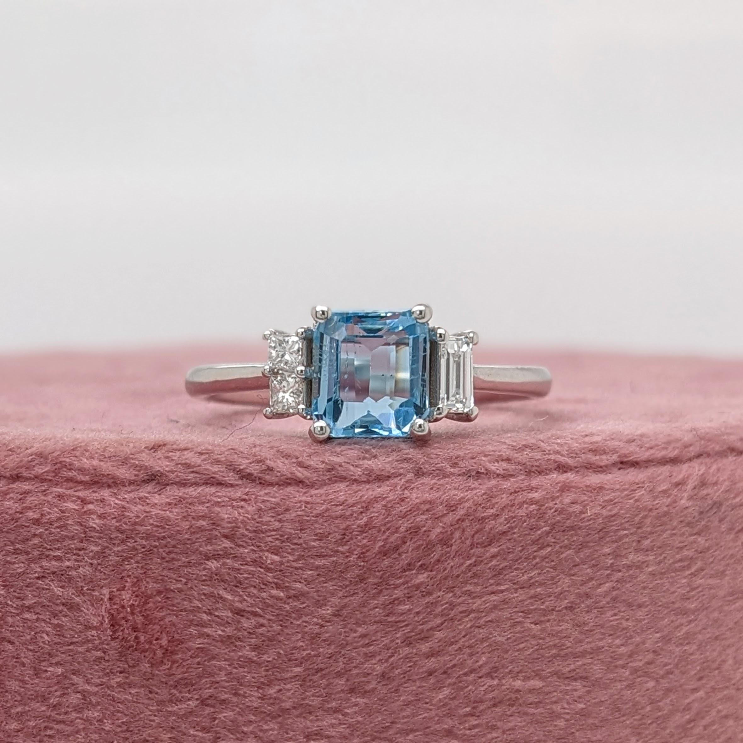 This beautiful ring features a 1.08 carat emerald cut aquamarine gemstone with natural earth mined baguette diamond accents, all set in solid 14K gold. This ring makes a lovely March birthstone gift for your loved ones! 

Specifications

Item Type: