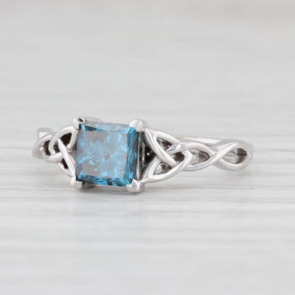 Gemstone Information:
*Natural Diamond*
Carats - 1ct
Cut - Princess
Color - Irradiated Blue
Clarity - SI1

Metal: 18k White Gold
Weight: 3 Grams 
Stamps: 18k
Face Height: 6.5 mm 
Rise Above Finger: 4.8 mm
Band / Shank Width: 1.5 mm

This ring is a