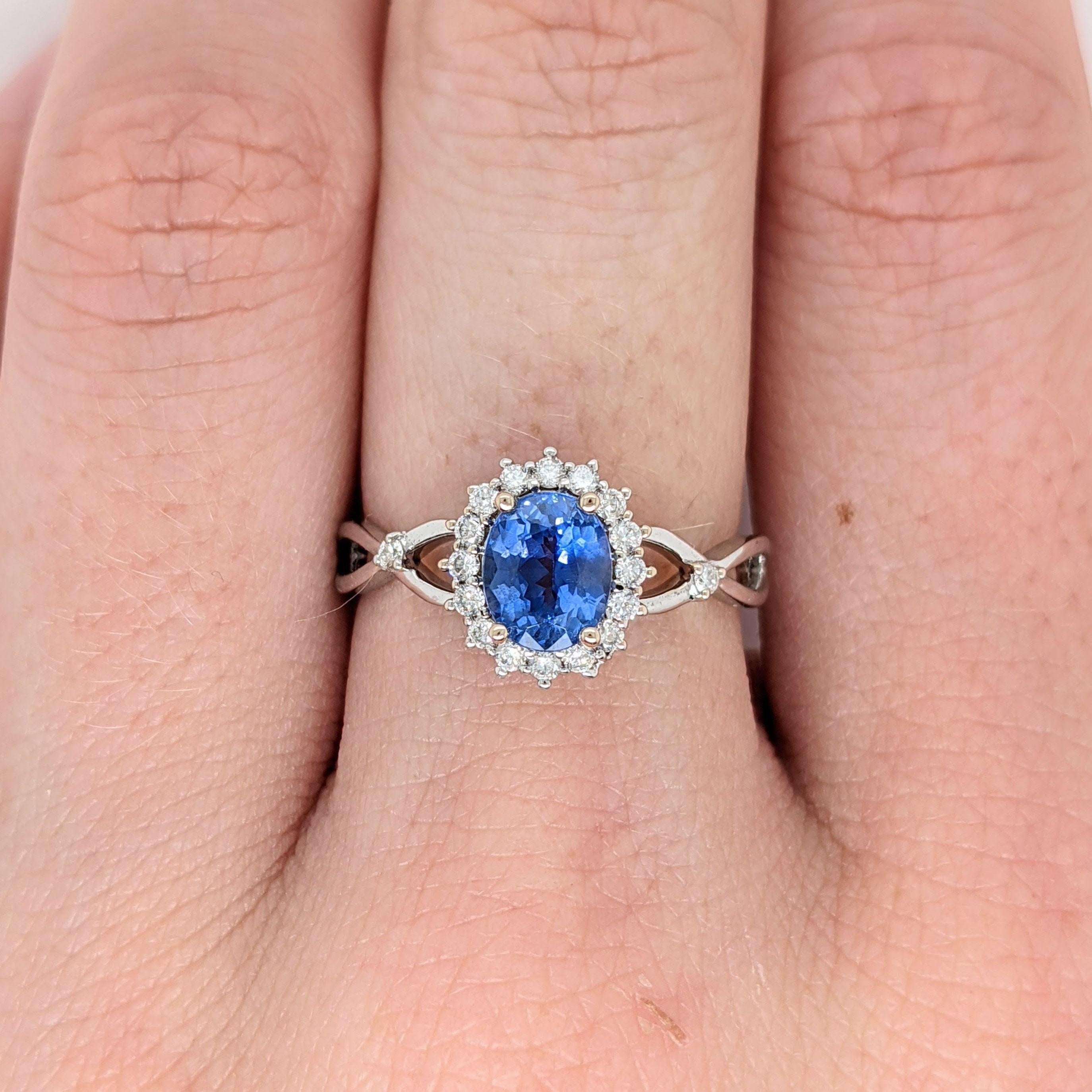 This beautiful ring features a 1.01 carat oval Blue Sapphire gemstone with natural earth mined diamonds set in solid 14K gold. This Blue Sapphire ring makes a lovely September birthstone gift for your loved ones! 

Item Type: Ring
Center