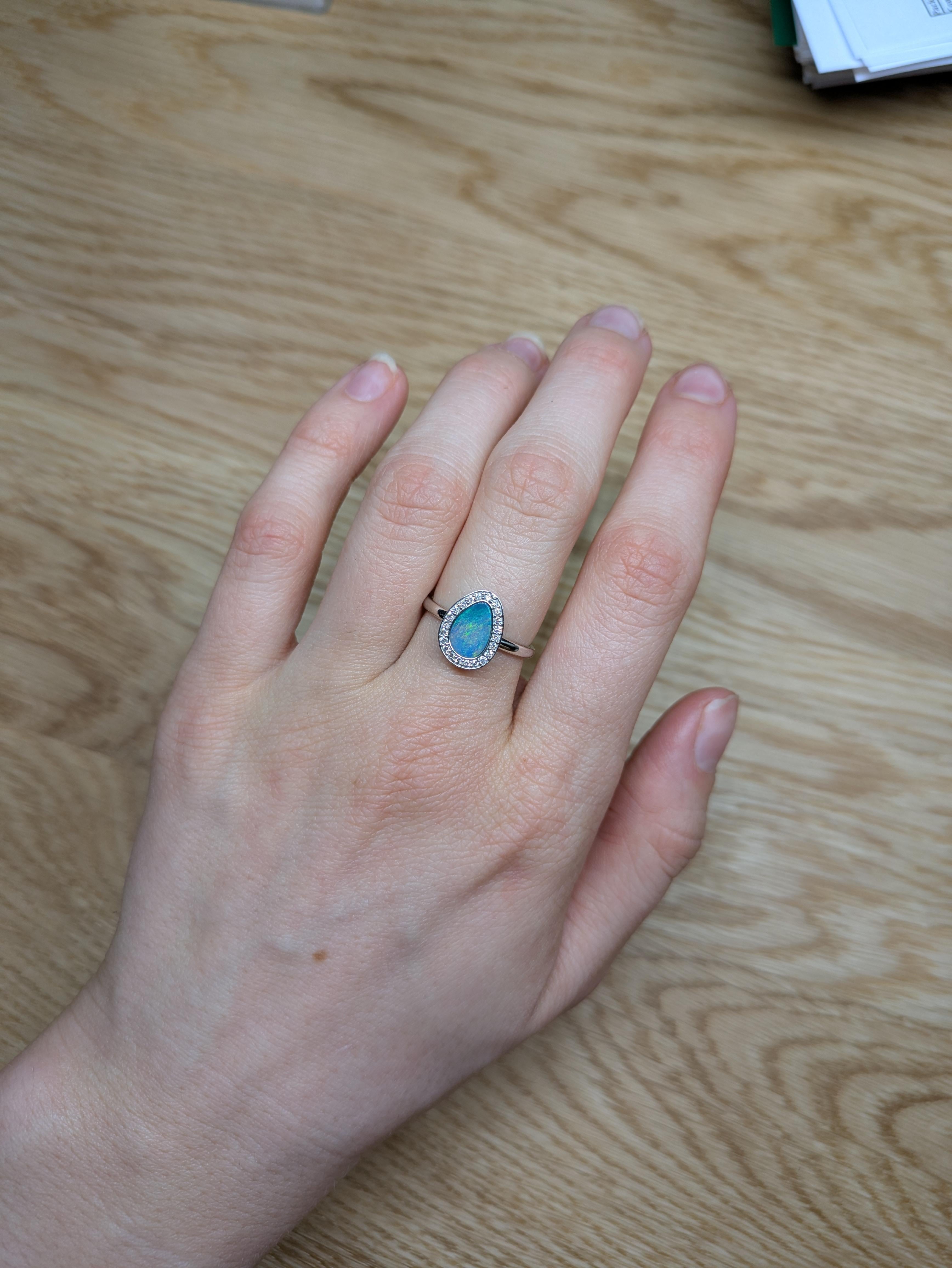 This ring is a breathtaking masterpiece that showcases the mesmerizing beauty of a 1.08ct Boulder Opal. Set in stunning 14K white gold, the 9x7mm fancy-shaped opal features a dazzling array of vibrant, multi-colored flashes, making each glance a