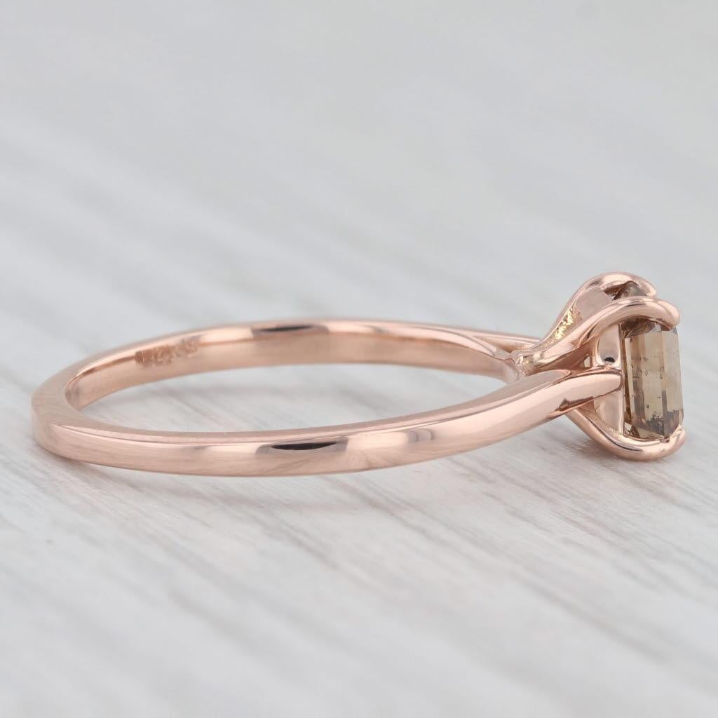 Gemstone Information:
- Natural Diamond -
Carats - 1ct 
Cut - Emerald
Color - Brown
Clarity - I1

Metal: 14k Rose Gold
Weight: 2.4 Grams 
Stamps: 14k
Face Height: 6.5 mm 
Rise Above Finger: 6.5 mm
Band / Shank Width: 1.6 mm

This ring is a size 7