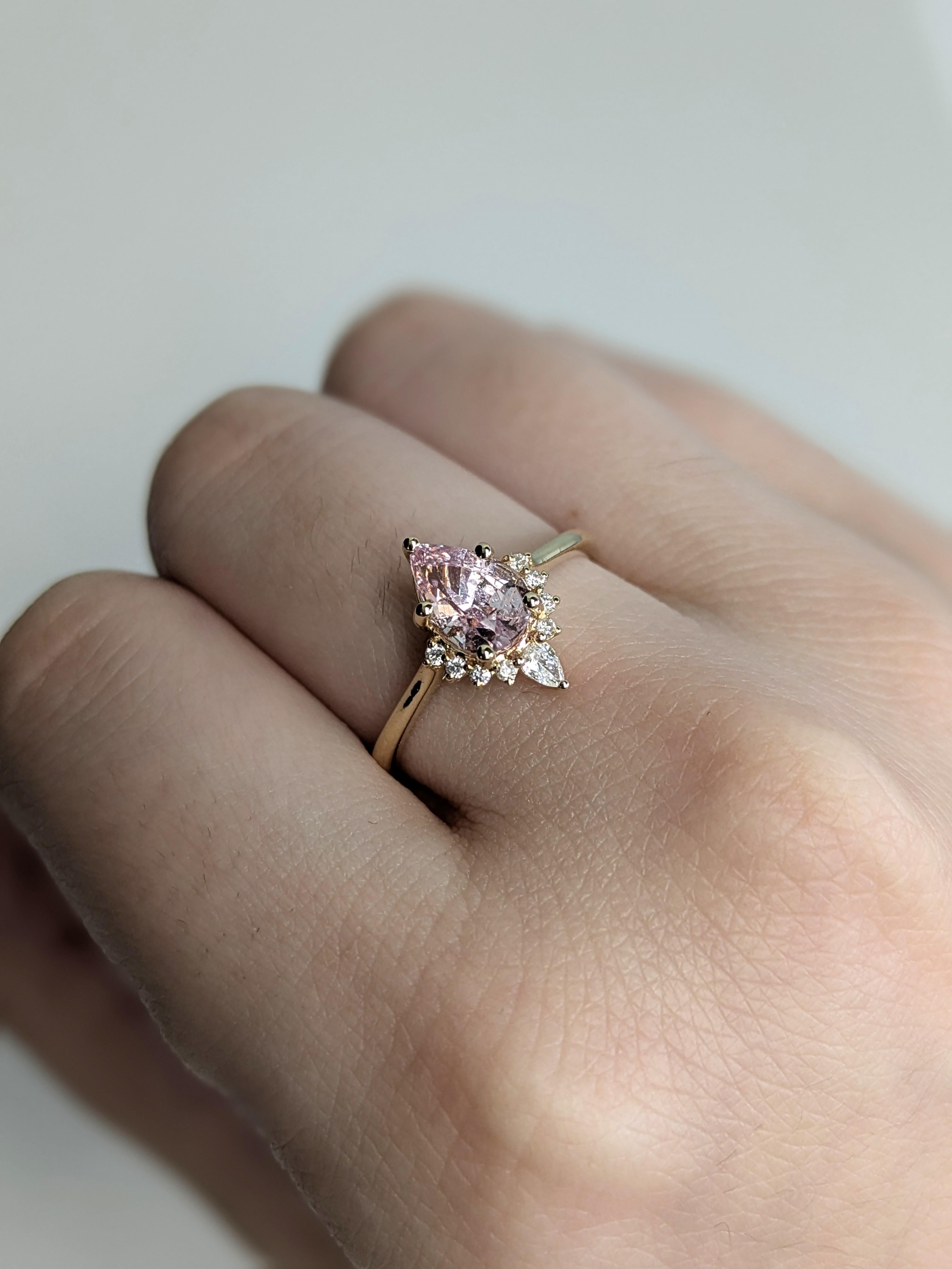 This stunning ring features a 1.11 carat intense fancy pink sapphire in a graceful pear shape, surrounded by ethically sourced diamond accents. Set in genuine 14K yellow gold, it’s a statement of refined beauty and charm.

