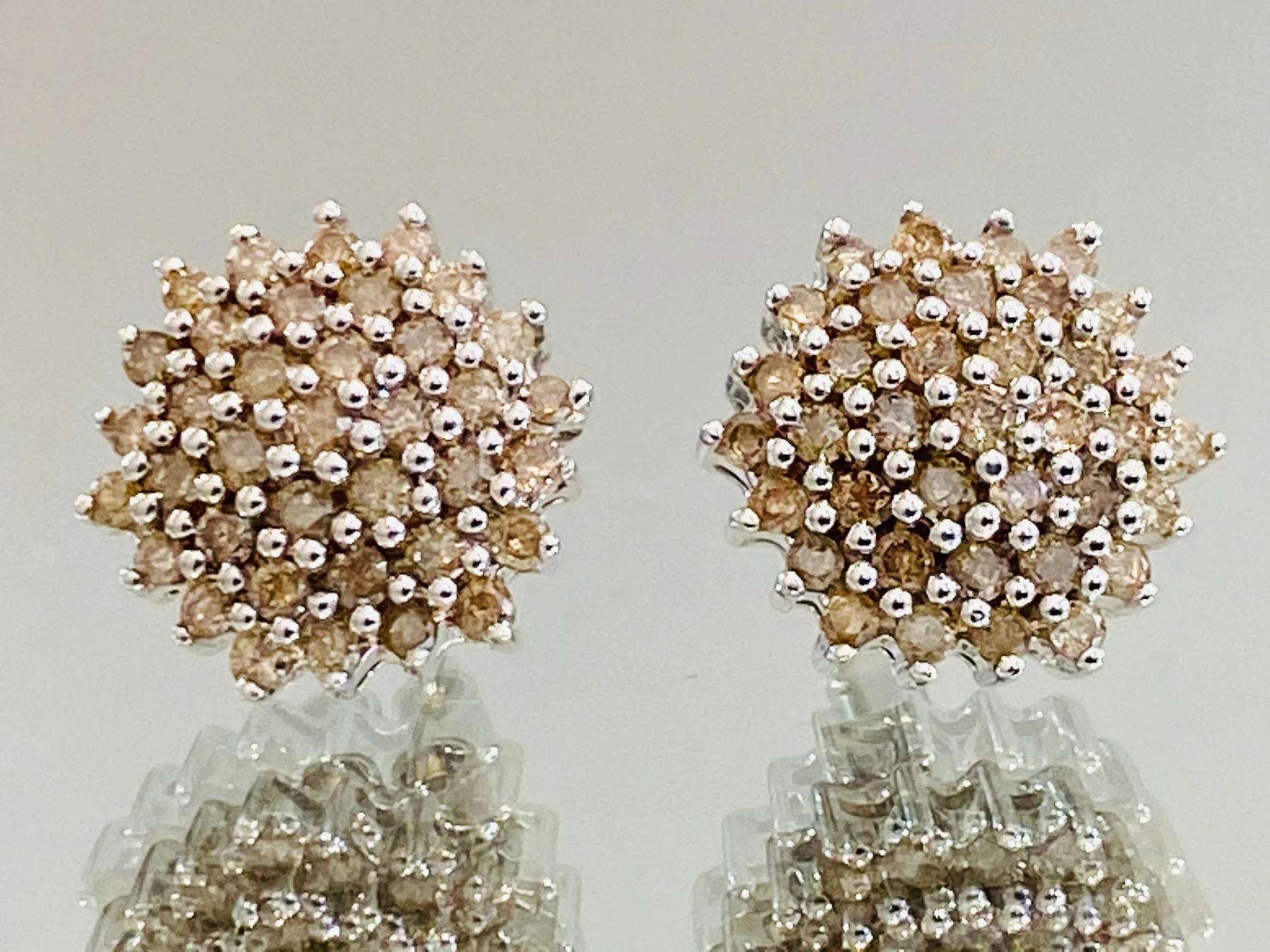 1ct Chocolate Diamond Cluster Earrings

Each earring containing a cluster of 50 chocolate diamonds each totalling .5cts. Claw setting in 9ct white gold. Lots of sparkle.

Additional information:
Size – Width 1.3cm
Composition - 9ct White Gold