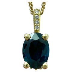 Collana con ciondolo a raggiera nascosta in oro giallo 18k con zaffiro blu intenso e diamante da 1 carato