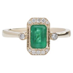 Anillo de esmeralda de 1 ct con diamantes extraídos de la tierra en oro amarillo macizo de 14 quilates EM 7x5 mm
