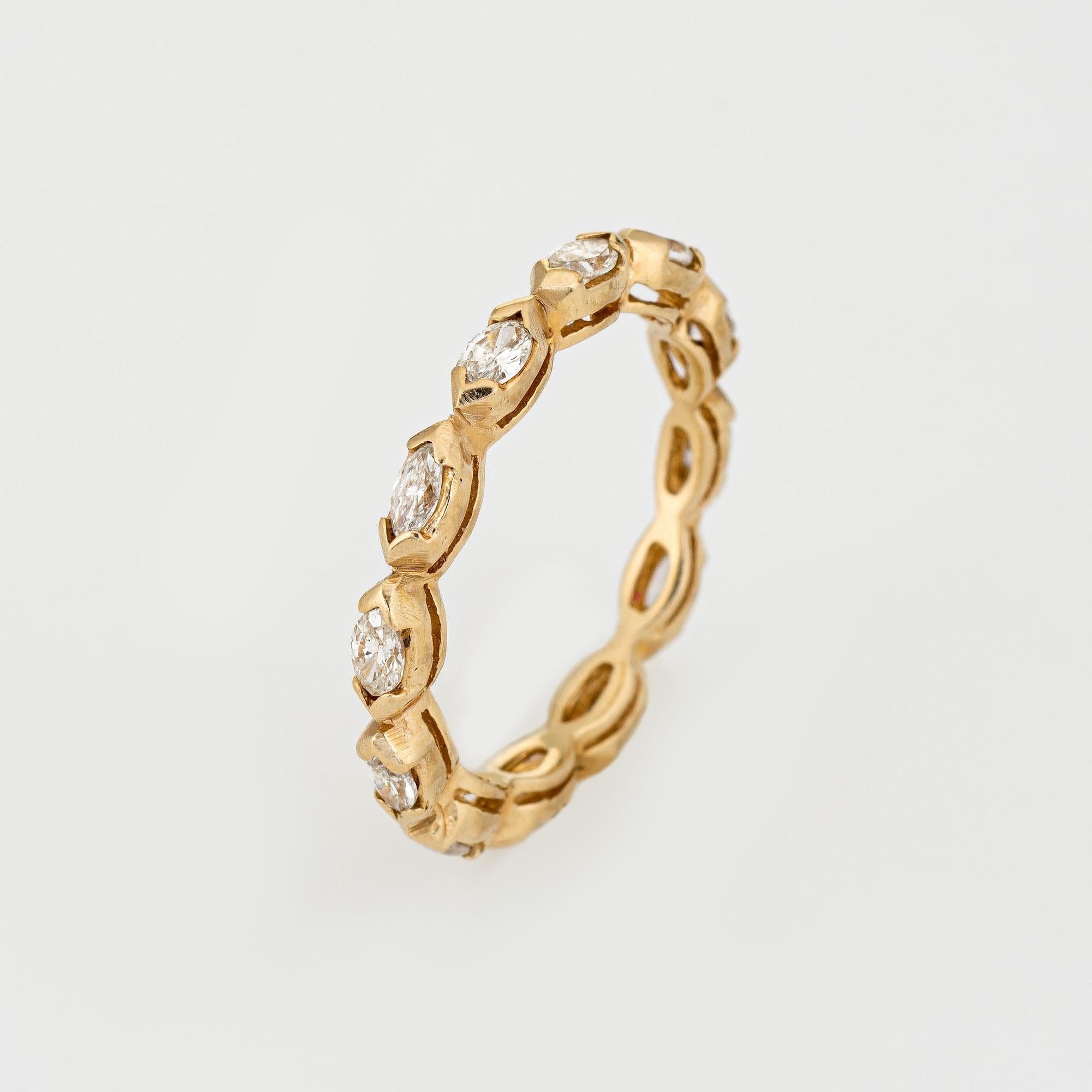 Stylish vintage diamond eternity ring (circa 1990s) crafted in 14 karat yellow gold. 

12 marquise cut diamonds total an estimated 1 carat (estimated at H-I color and VS2-SI2 clarity). 

The eternity ring is set with marquise cut diamonds