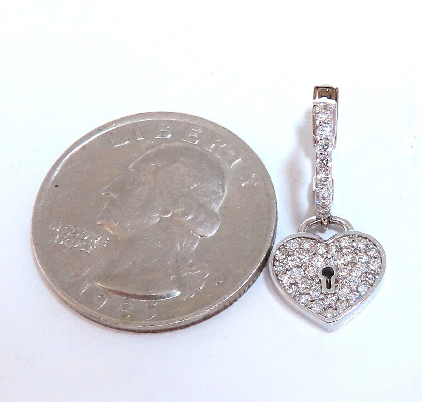 Heart Flat diamond earrings.

1 carat natural round diamonds

G color vs2 clarity

14kt white gold 5 g

Earrings measure 24mm long 

$6000 appraisal certificate to accompany