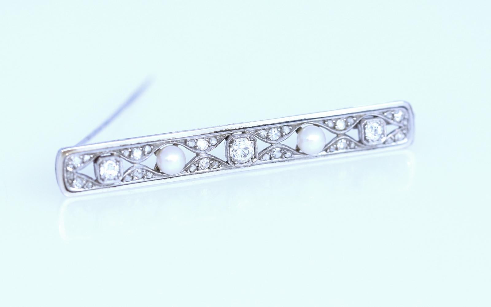 1Ct Old-cut Diamonds Pearls White Gold Bar Brooch. White Gold brooch contains two Pearls, three old European cut Diamonds weighing approximately 1 Ct in total. Additional 36 old European and mixed cut diamonds. Europe 1930. 
One of the fine,