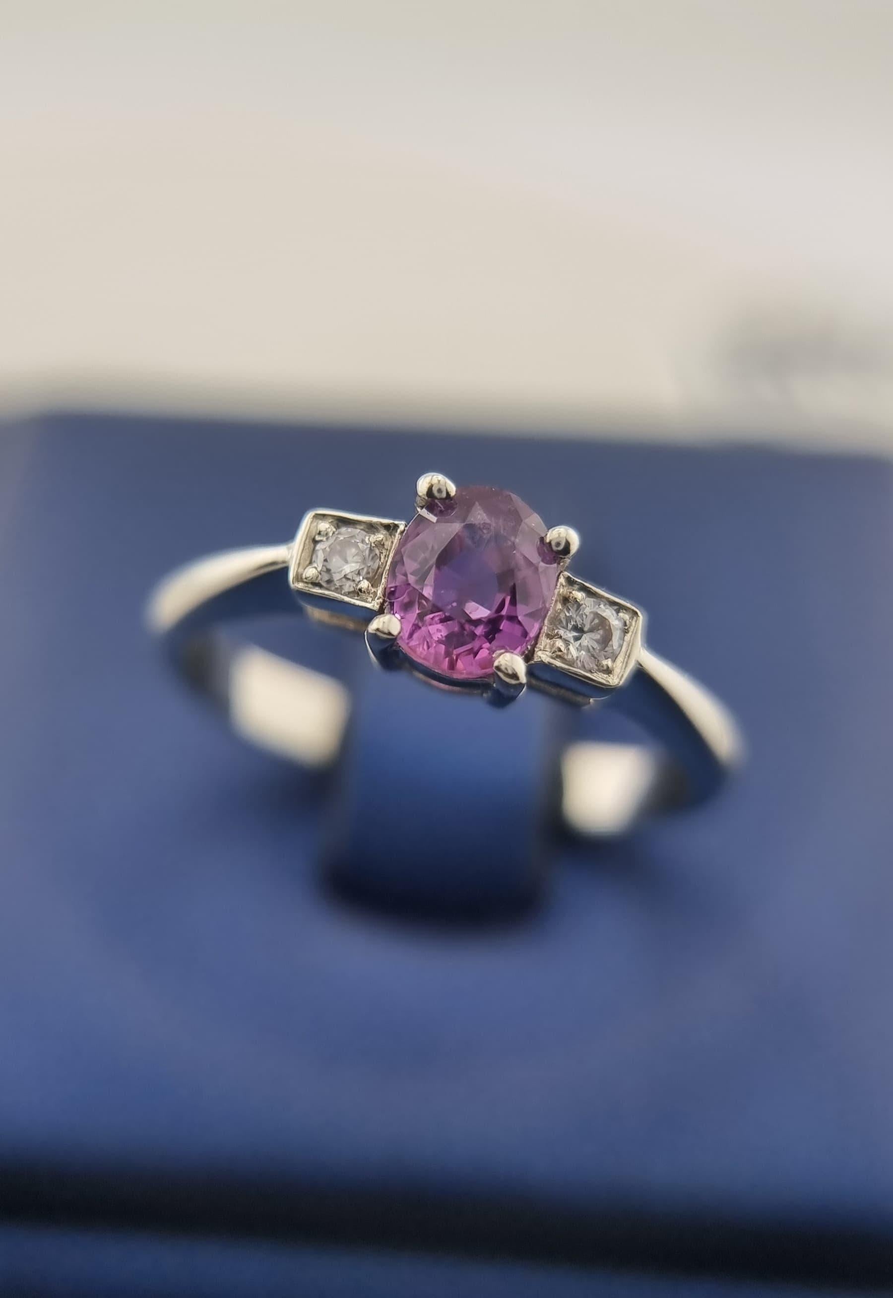 1ct Oval-Cut Natural Pink Sapphire Ring with Zircon Accents

This ring features a 1ct natural pink sapphire in an elegant oval cut, measuring 5.8x4.8mm. The sapphire's rich pink color is vivid yet balanced, with a natural brilliance that draws