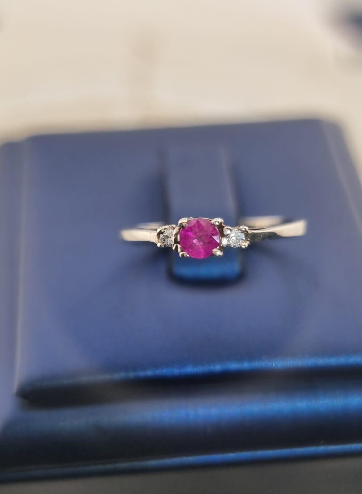 This 1ct Oval Natural Pink Sapphire Ring on Platinum Silver is timeless elegance personified, a true embodiment of grace and sophistication. This exquisite piece of jewelry features a stunning 1x5.8x4.8mm oval natural pink sapphire at its center,