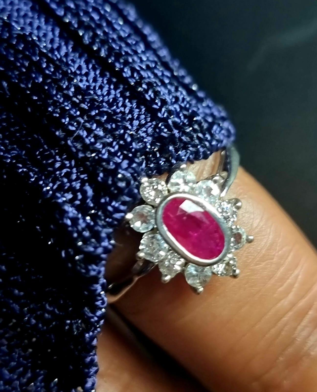 Indulge in the timeless allure of ruby and sapphire combination with this exquisite 1.0ct Oval 100% Natural Ruby Statement Ring surrounded by 3ctw White Sapphire . This beautifully crafted piece is designed to make a statement, combining the pink of