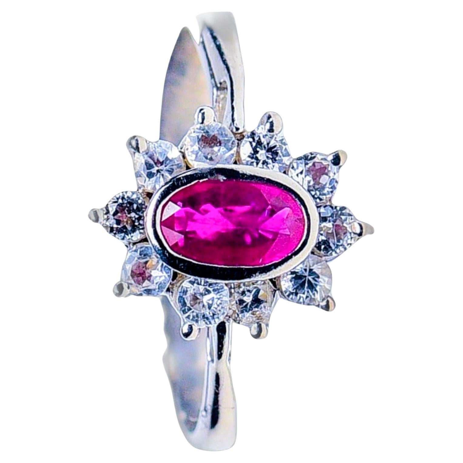 1ct Oval Natural Ruby and White Sapphire Statement Ring in Platinum Silver

This exquisitely designed statement ring features a 1ct natural oval ruby as its centerpiece, surrounded by a halo of ten sparkling white sapphires, set in polished