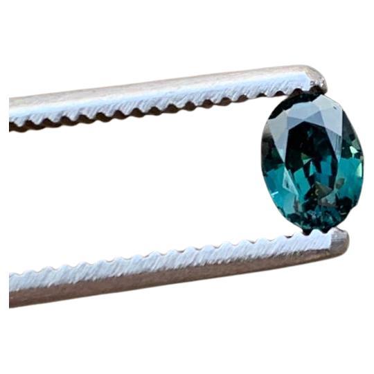Step into a world of serene beauty with this EYE CLEAN 1.3-carat Oval Natural UNHEATED Teal Blue Sapphire Gemstone. Boasting an eye-clean clarity, this gemstone is a paragon of purity, with no visible inclusions to detract from its brilliance. The