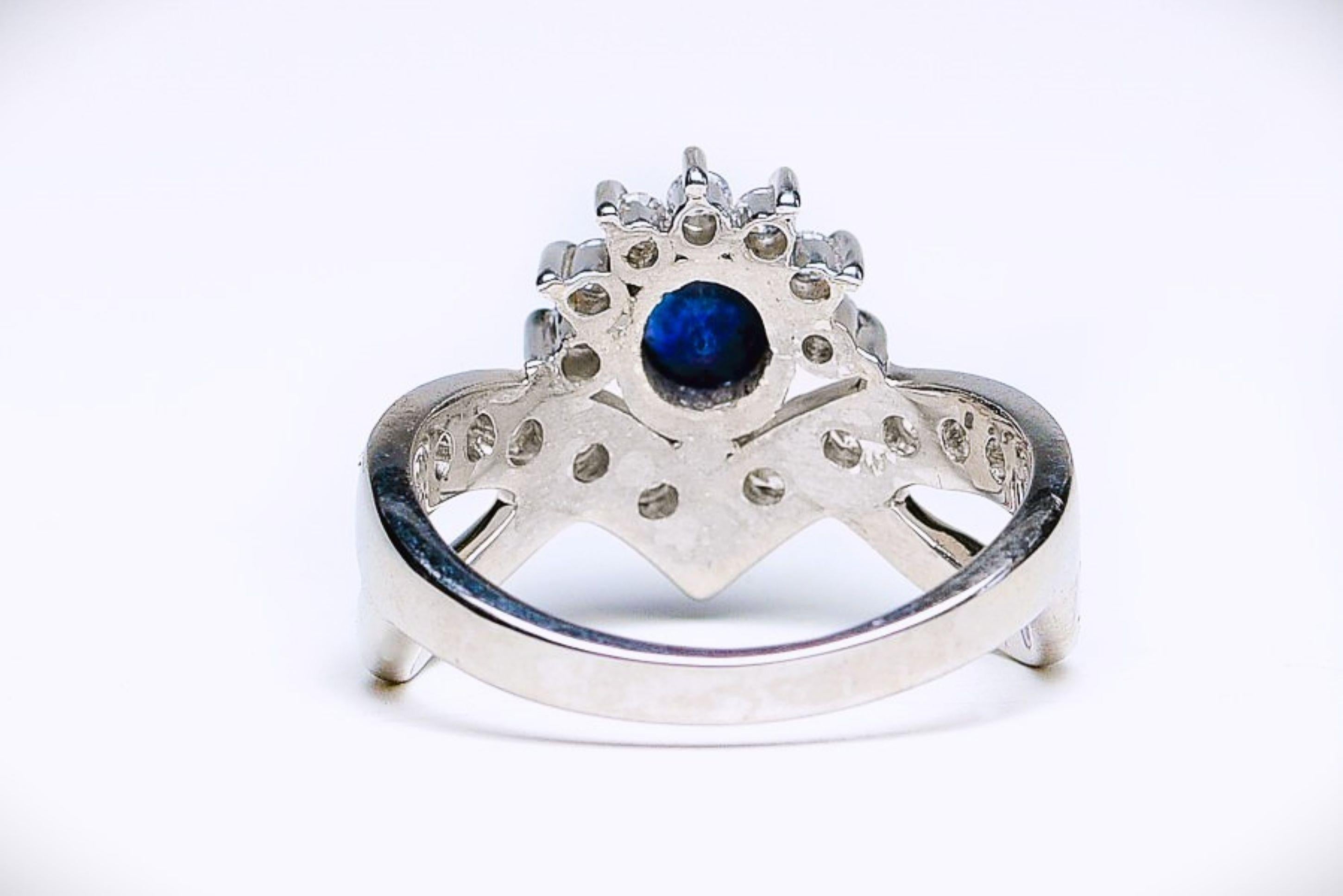 Elevate your style with the exquisite beauty of our Regal Round Cut Blue Sapphire Ring of Platinum Sterling Silver. This remarkable piece of jewelry is designed to make a lasting impression. At its heart is a captivating 1 carat round cut blue