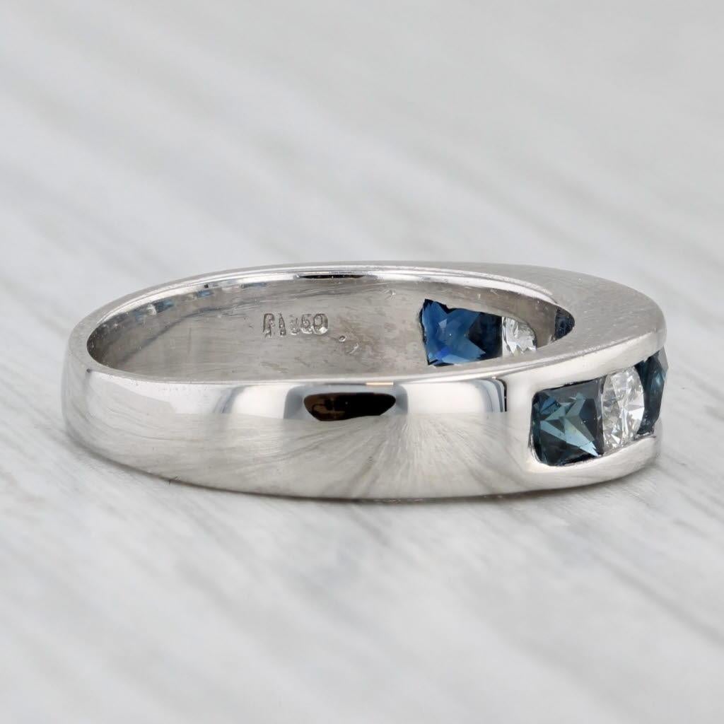 Gemstone Information:
- Natural Sapphires -
Total Carats - 0.70ctw
Cut - Princess
Color - Dark Blue
Treatment - Heated

- Natural Diamonds -
Total Carats - 0.30ctw
Cut - Round Brilliant
Color - F - G
Clarity - VS2 - SI1

Metal: 950 Platinum
Weight: