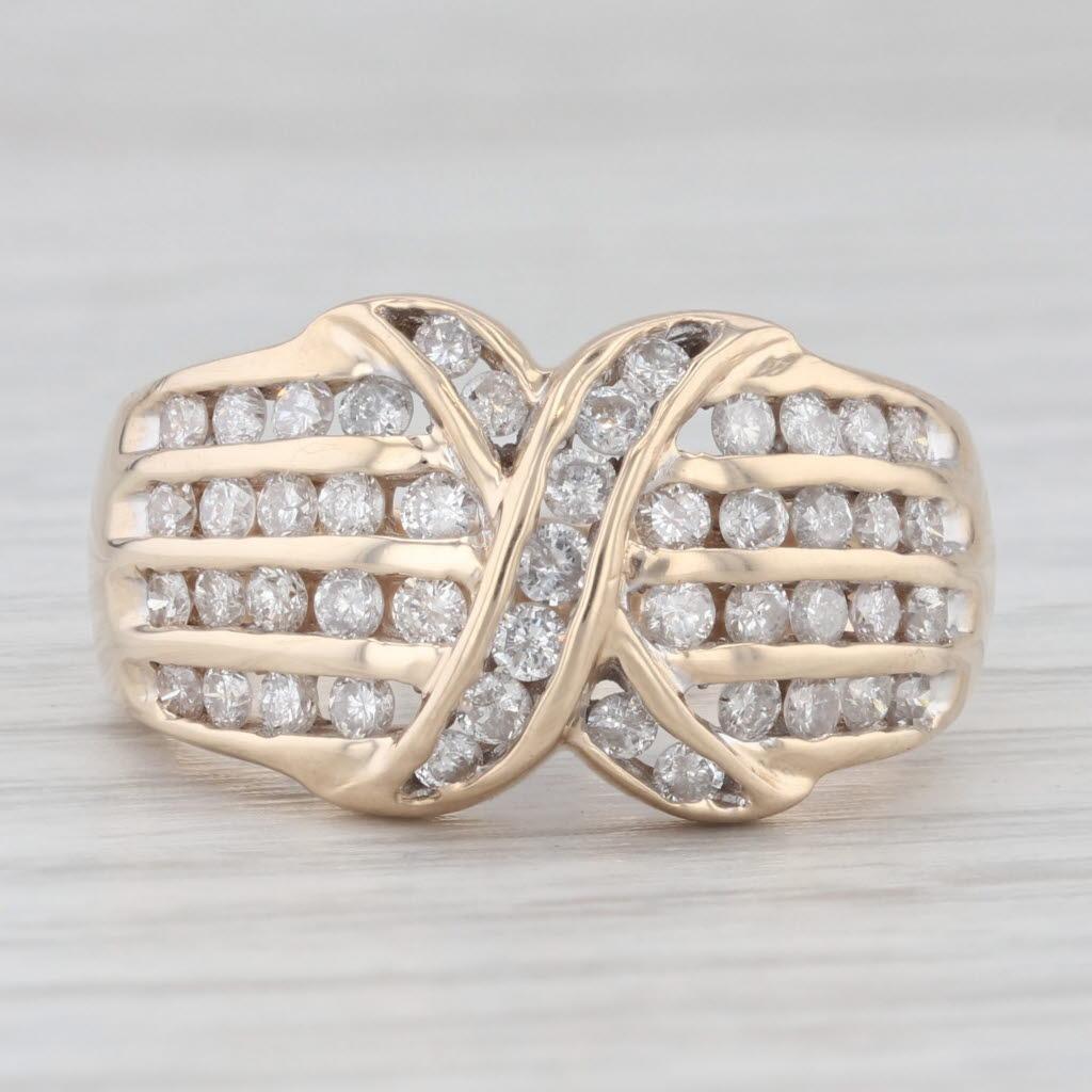 Gemstone Information:
- Natural Diamonds -
Total Carats - 1ctw
Cut - Round Brilliant
Color - H - I
Clarity - I1 - I2

Metal: 10k Yellow Gold
Weight: 5.3 Grams 
Stamps: 10k
Face Height: 12.1 mm 
Rise Above Finger: 5.1 mm
Band / Shank Width: 3