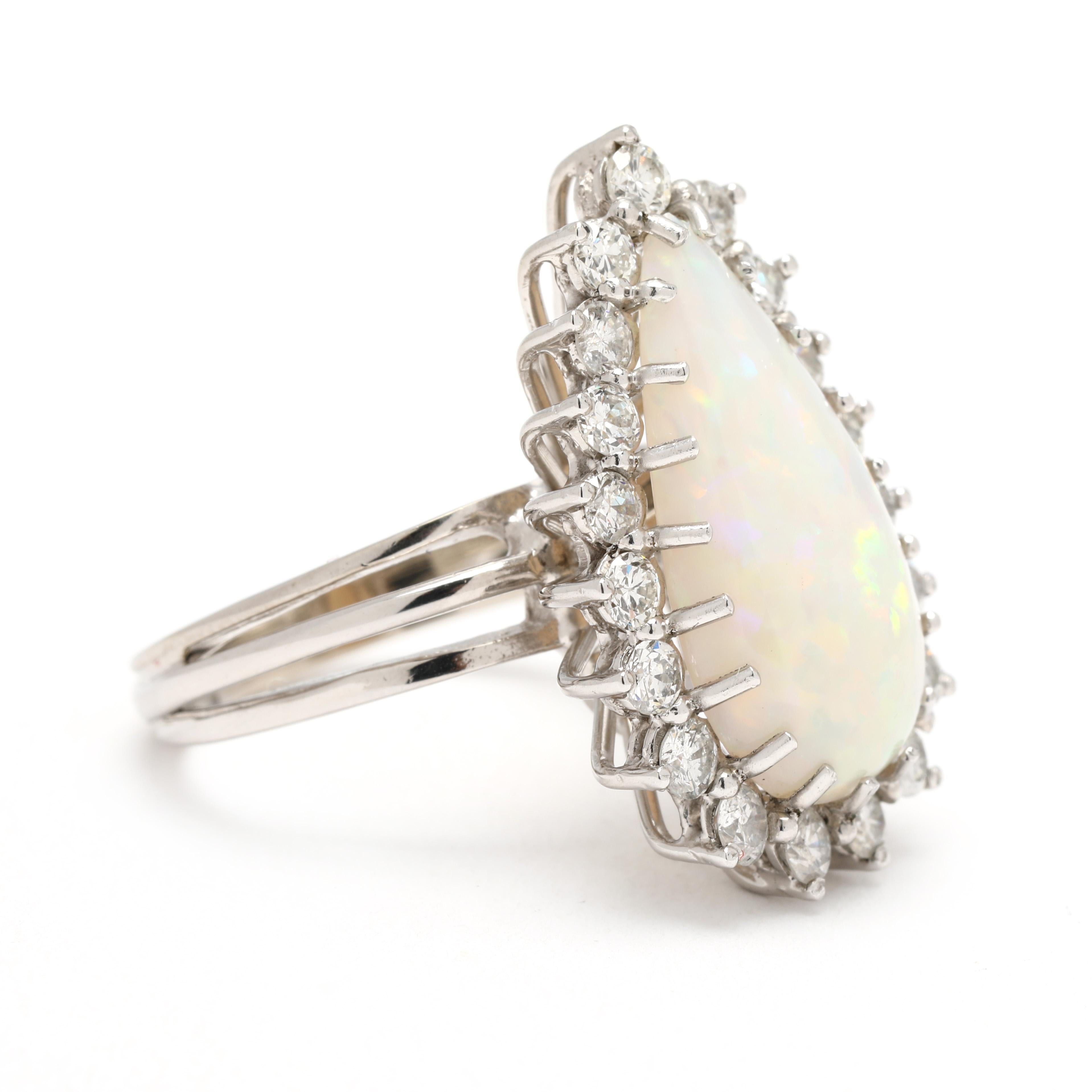 Stones:
opal
pear cab
20 x 9.5 mm
*minute chip
diamond
round brilliant cut
2.25 - 2.5
approximately 1 total carat
HI color/ SI1-I1 clarity

Ring Size 6.25

Rise Off Of Finger: 10 mm

Length: 25 mm

Weight: 6.1 grams

Stamps: 14k (tested)

SKU: