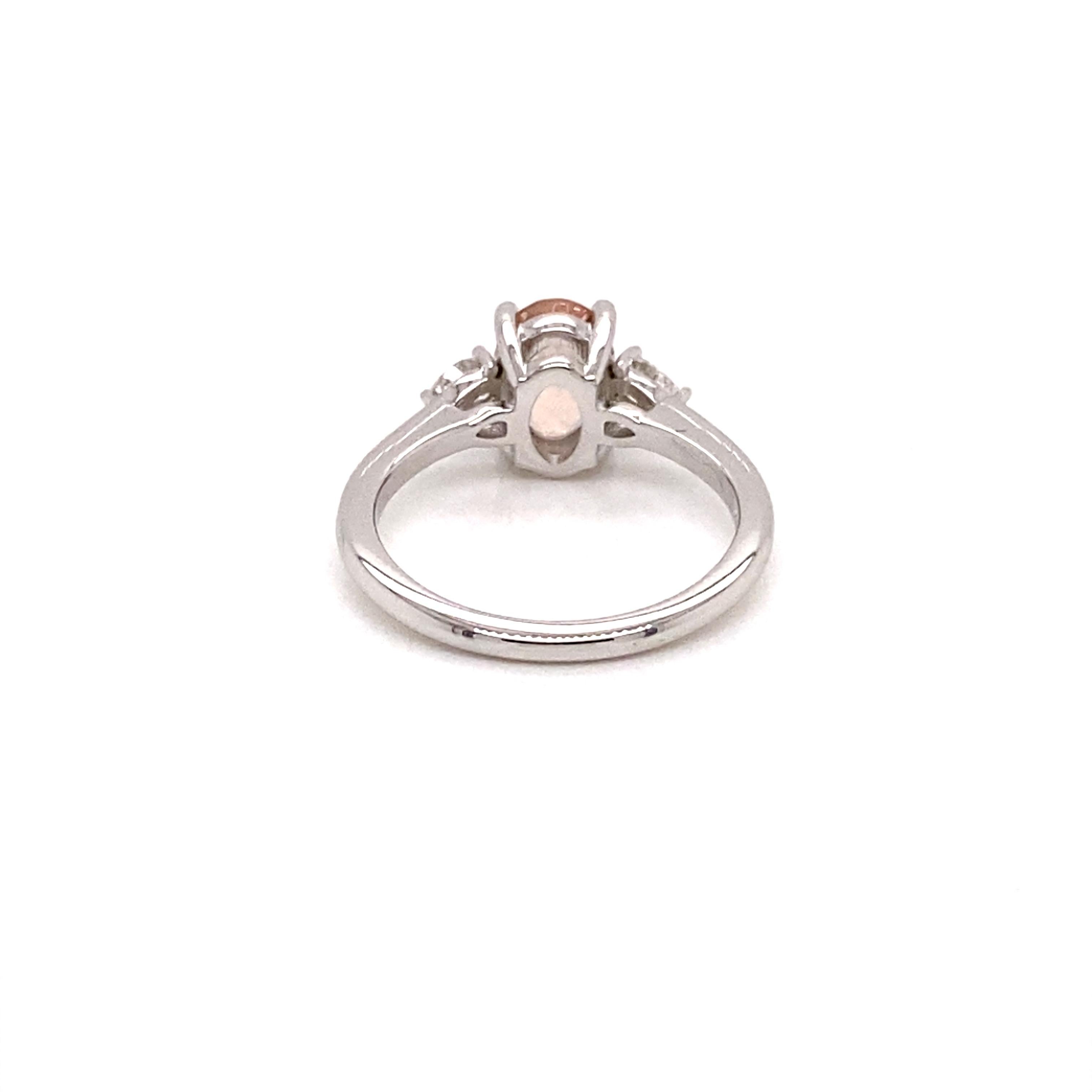 Stunning Eye Catching Peachy Hued Oval Morganite, flanked by scintillating pear-shaped diamonds on each side.
Elegantly set in a polished 14k White gold to complement and contrast the beautiful 1.20 ct Oval Peachy Hued Morganite.
VS F/G Colour