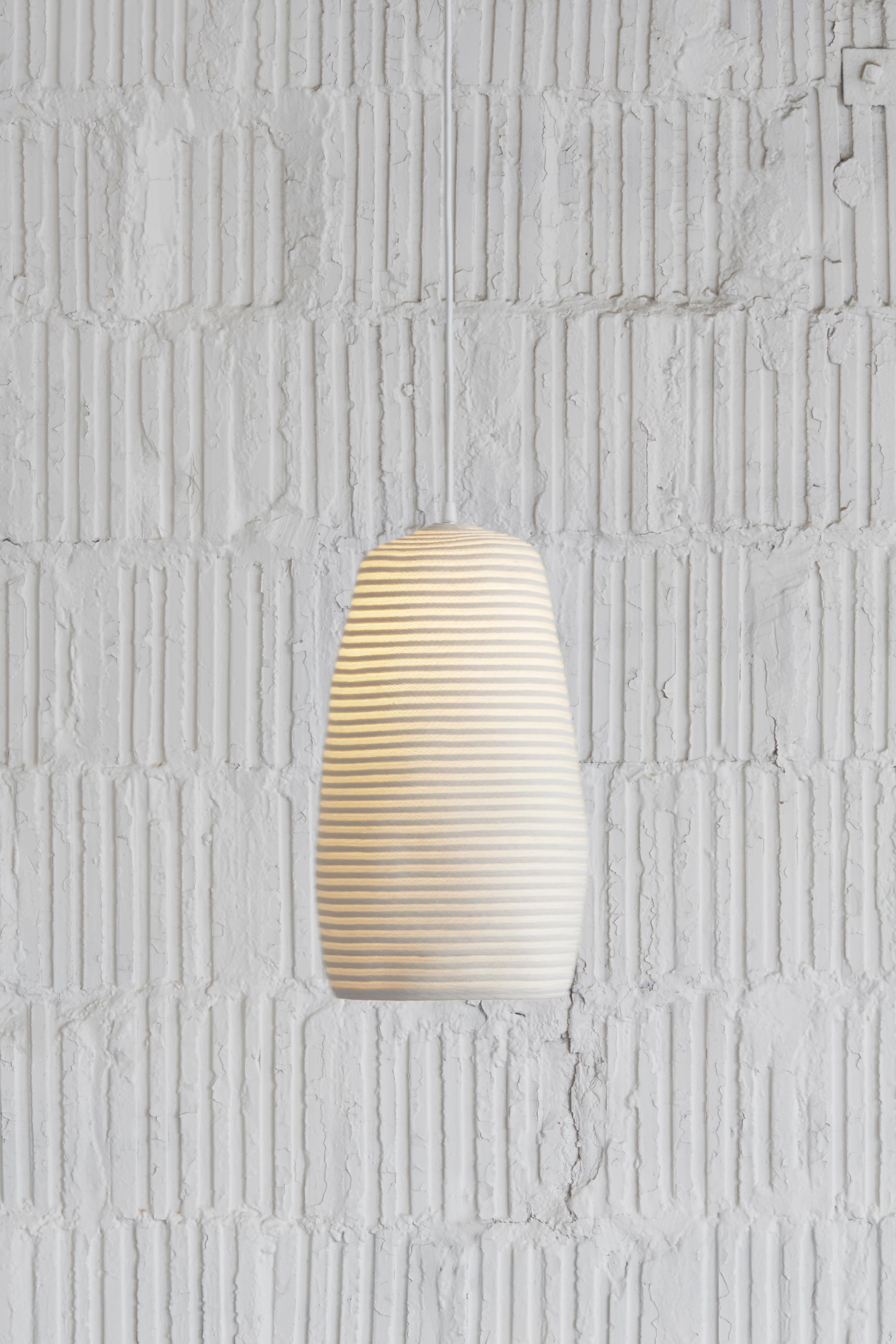 Designed in 2013. This piece made in 2020.
Natural cotton cord, white nylon cord, white nylon thread, 18/3 SVT electrical cord with white braided nylon sleeve.
Includes (1) white swag hook and (1) 4.75” diameter white canopy.

Doug Johnston’s