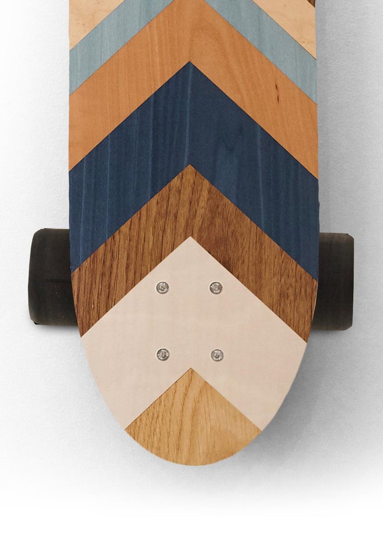 This marquetry skateboard from the  w o o d p o p  studio is an example of the type of modern marquetry that  w o o d p o p  is becoming synonymous with.  Since its inception 10 years ago - the studio has specialised in marquetry and inlay work;