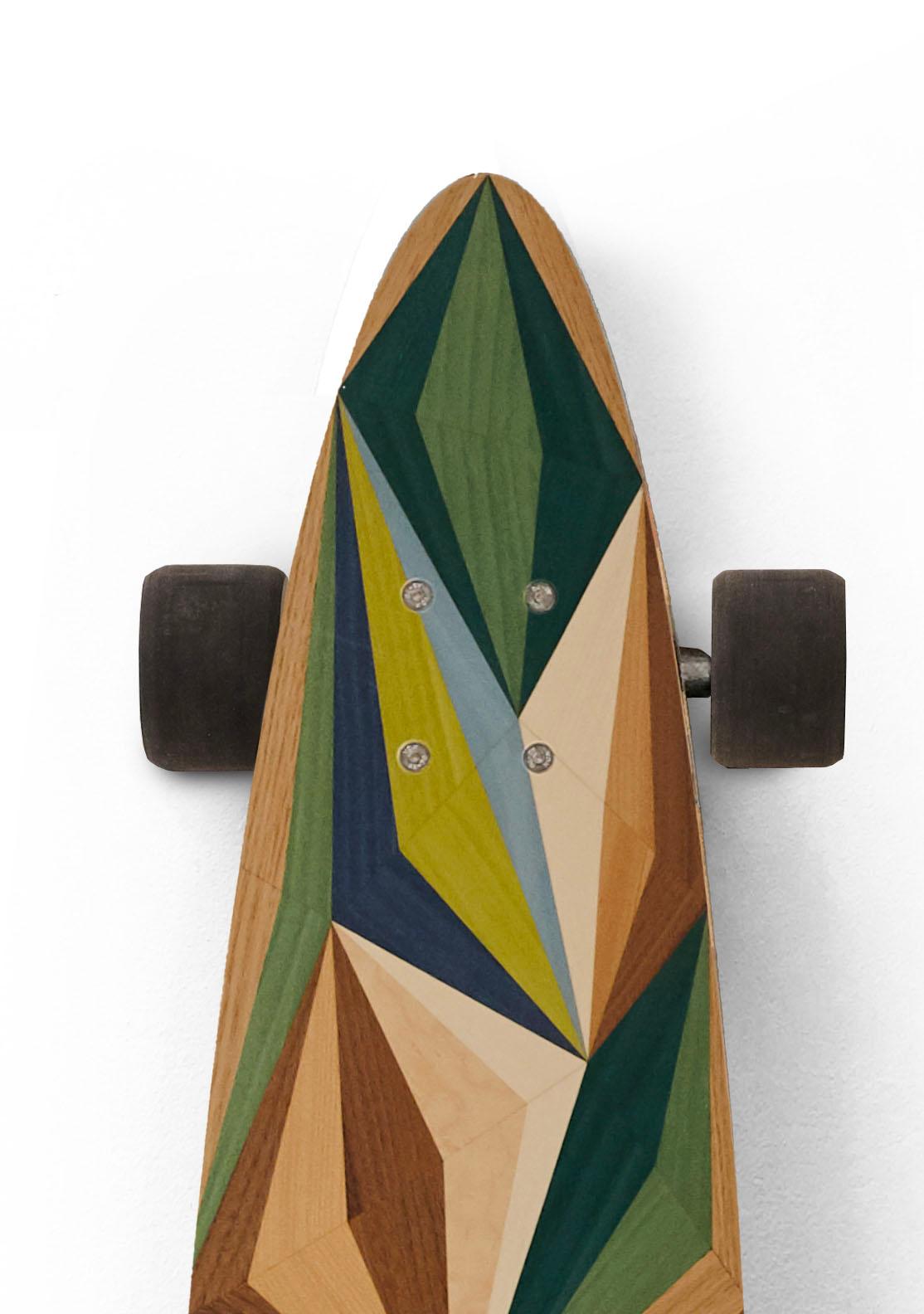 This marquetry skateboard from the  w o o d p o p  studio is an example of the type of modern marquetry that  w o o d p o p  is becoming synonymous with.  Since its inception 10 years ago - the studio has specialised in marquetry and inlay work;