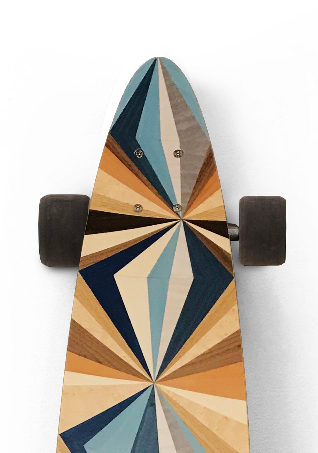 This marquetry skateboard from the  w o o d p o p  studio is an example of the type of modern marquetry that  w o o d p o p  is becoming synonymous with.  Since its inception 10 years ago - the studio has specialised in marquetry and inlay work;