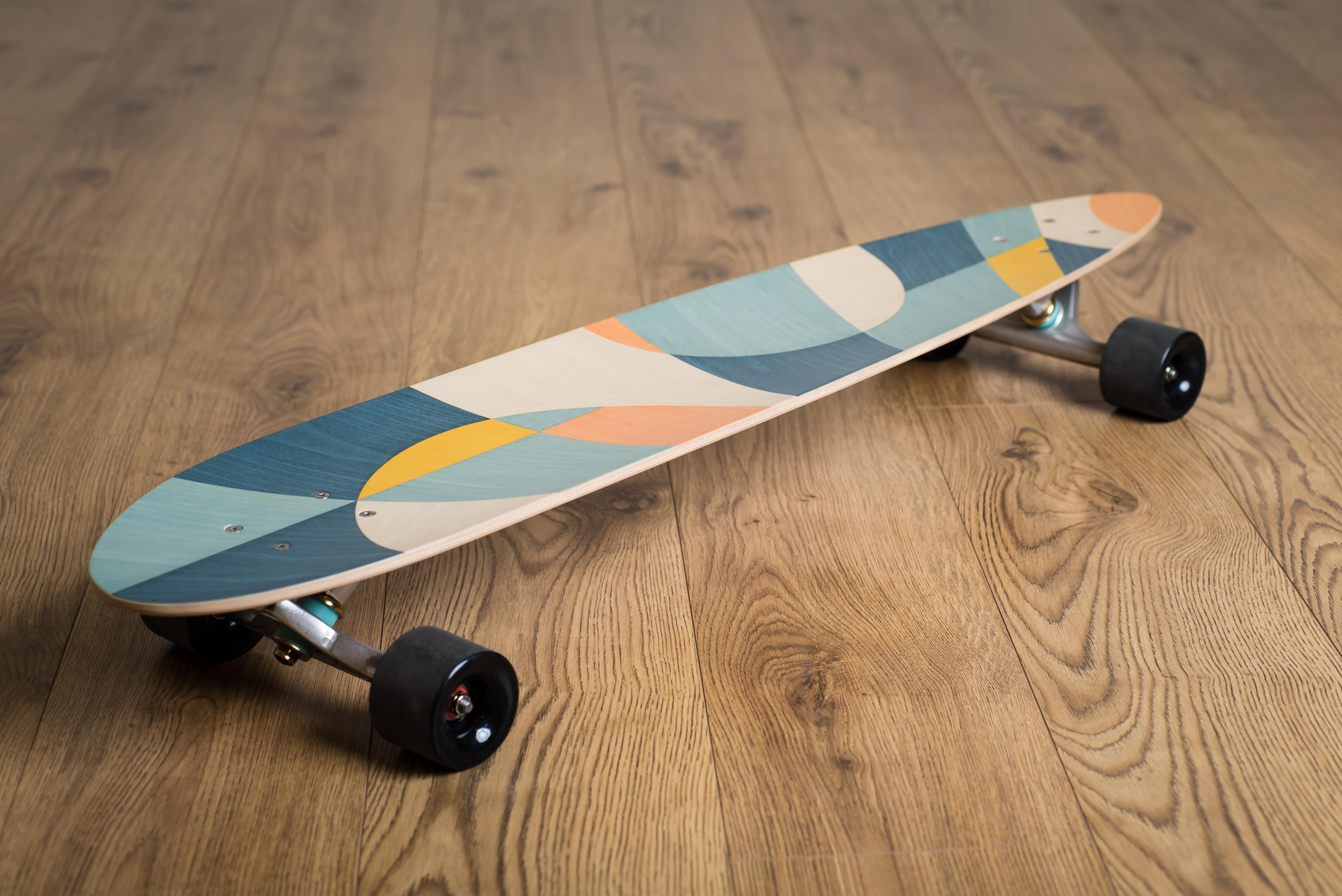 The w o o d p o p pintail longboards are handcrafted in workshops on either side of the Welsh/English border the UK. Each one is made from best quality Finnish Birch and vacuum laminated to form a concave deck featuring a unique marquetry inlay