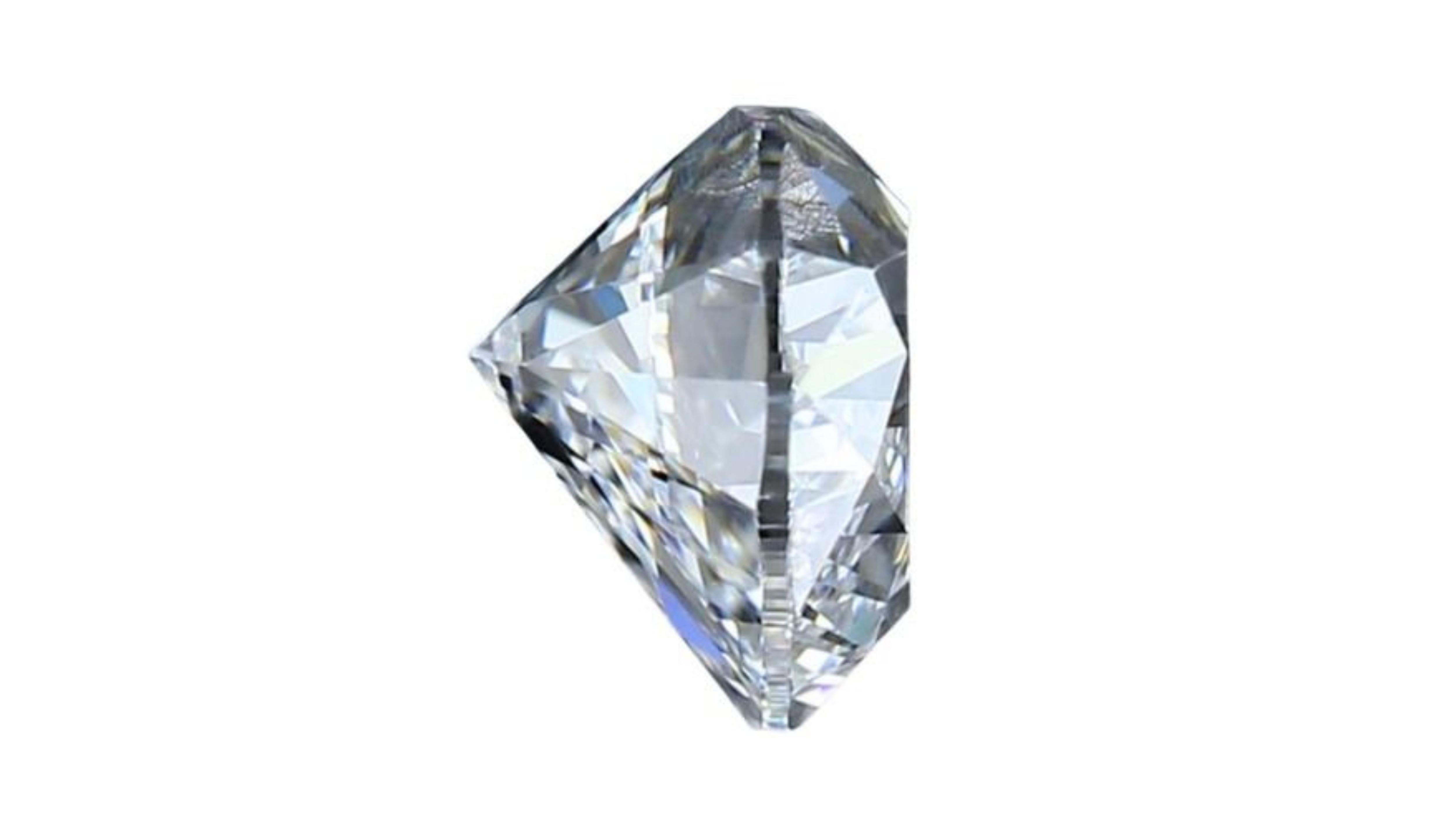 This stunning heart brilliant cut diamond is a rare and valuable gem. It is perfectly cut and polished to maximize its brilliance and sparkle. The color is D, the highest possible grade, and the clarity is VS1, meaning that it has very few