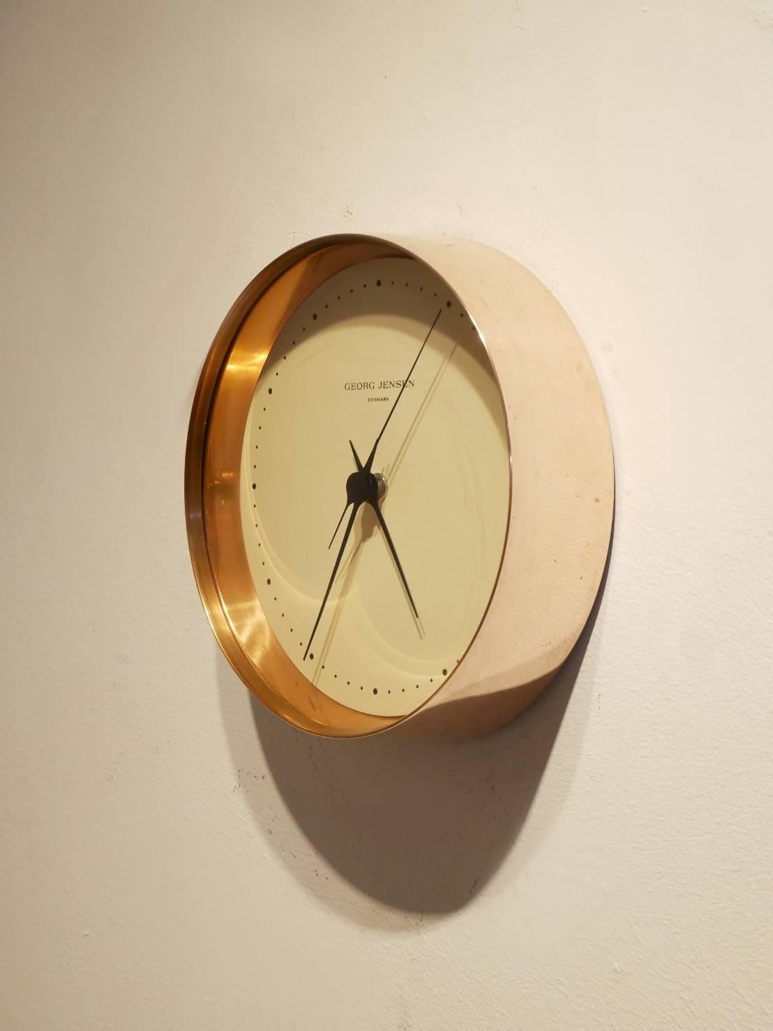 Rare copper rimmed clock from famed modernist silver designer Henning Koppel for Goerg Jensen. This 1st edition copper version of this clock has been out of production for decades.