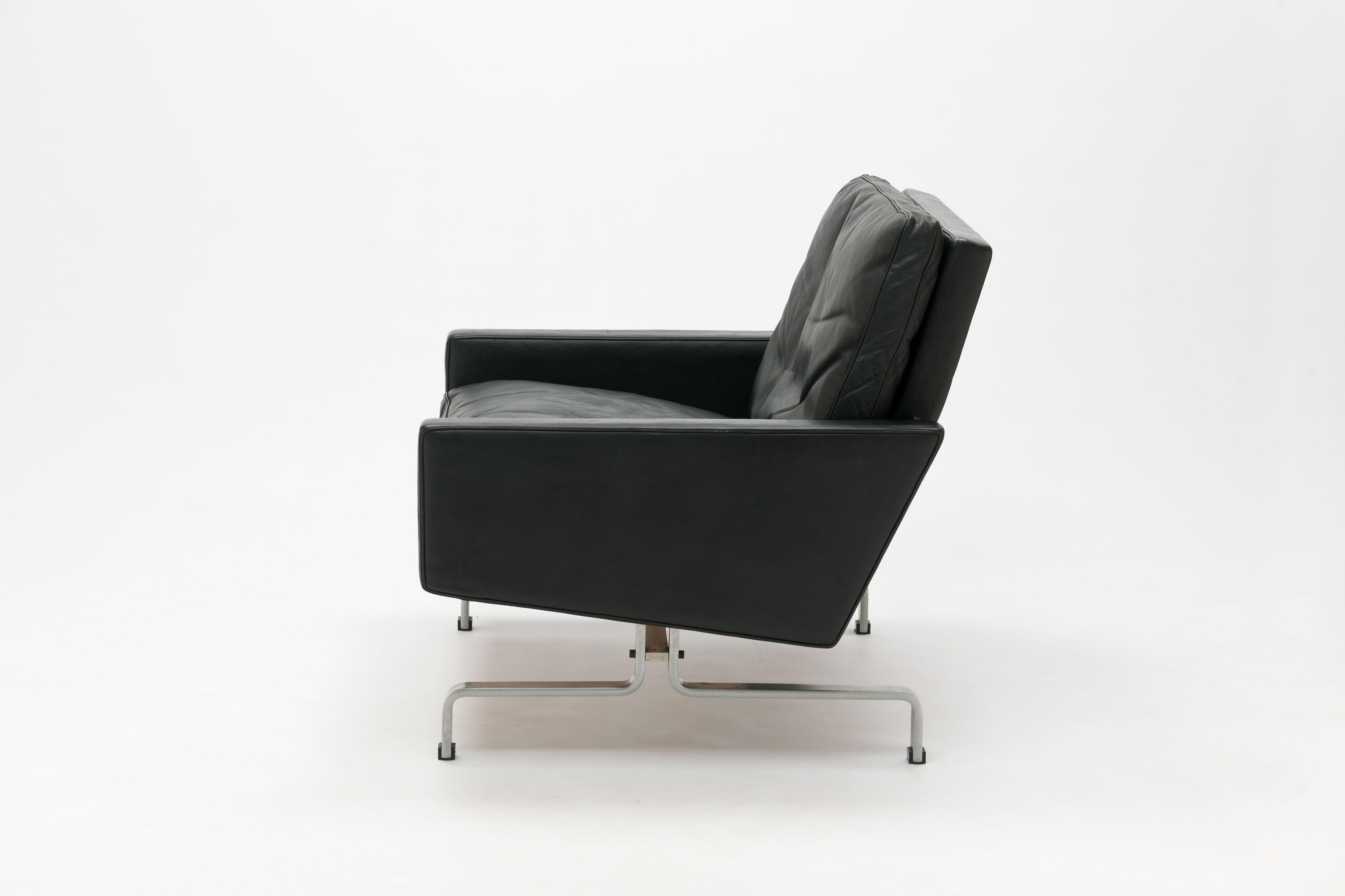 Poul Kjaerholm Pk31 lounge chair from First production series executed by maker Ejvind Kold Christensen (see marking on image #13 + 14) in original black leather.

 