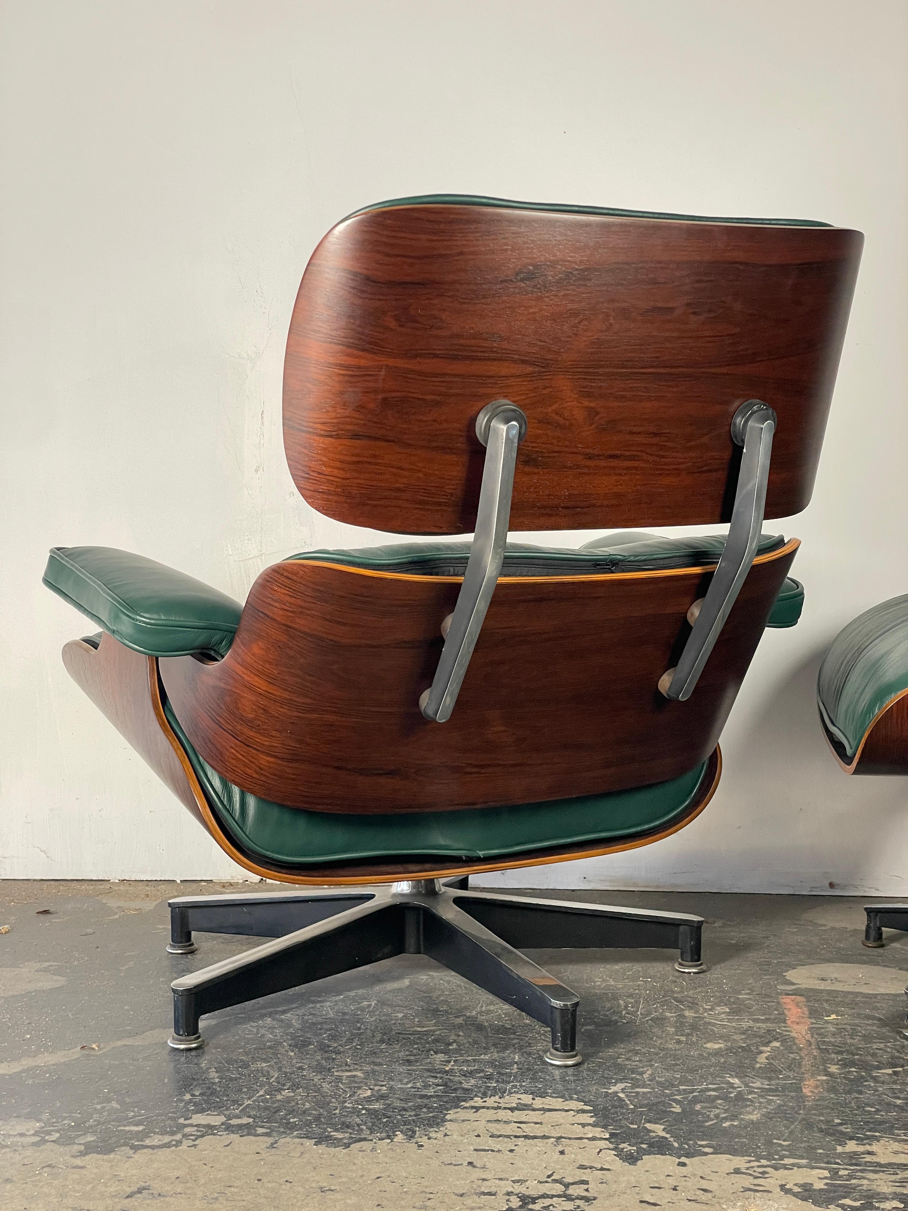 Just arrived! This incredible chair has been restored with refinished rosewood shells, new shock mounts, and brand new soft high quality full-analine hunter green leather and down-filled cushions. We love how the hunter green cushions make the deep