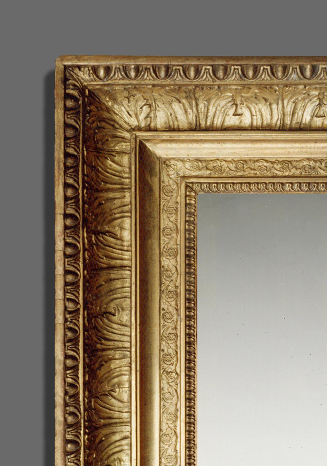 A luxurious and ornate 1st half 19th century French Empire frame. Its profile is concave with a cavetto and frieze, with the following ornament constructed in applied molded plaster of Paris: egg-&-dart, acanthus leaves, scrolling foliage,