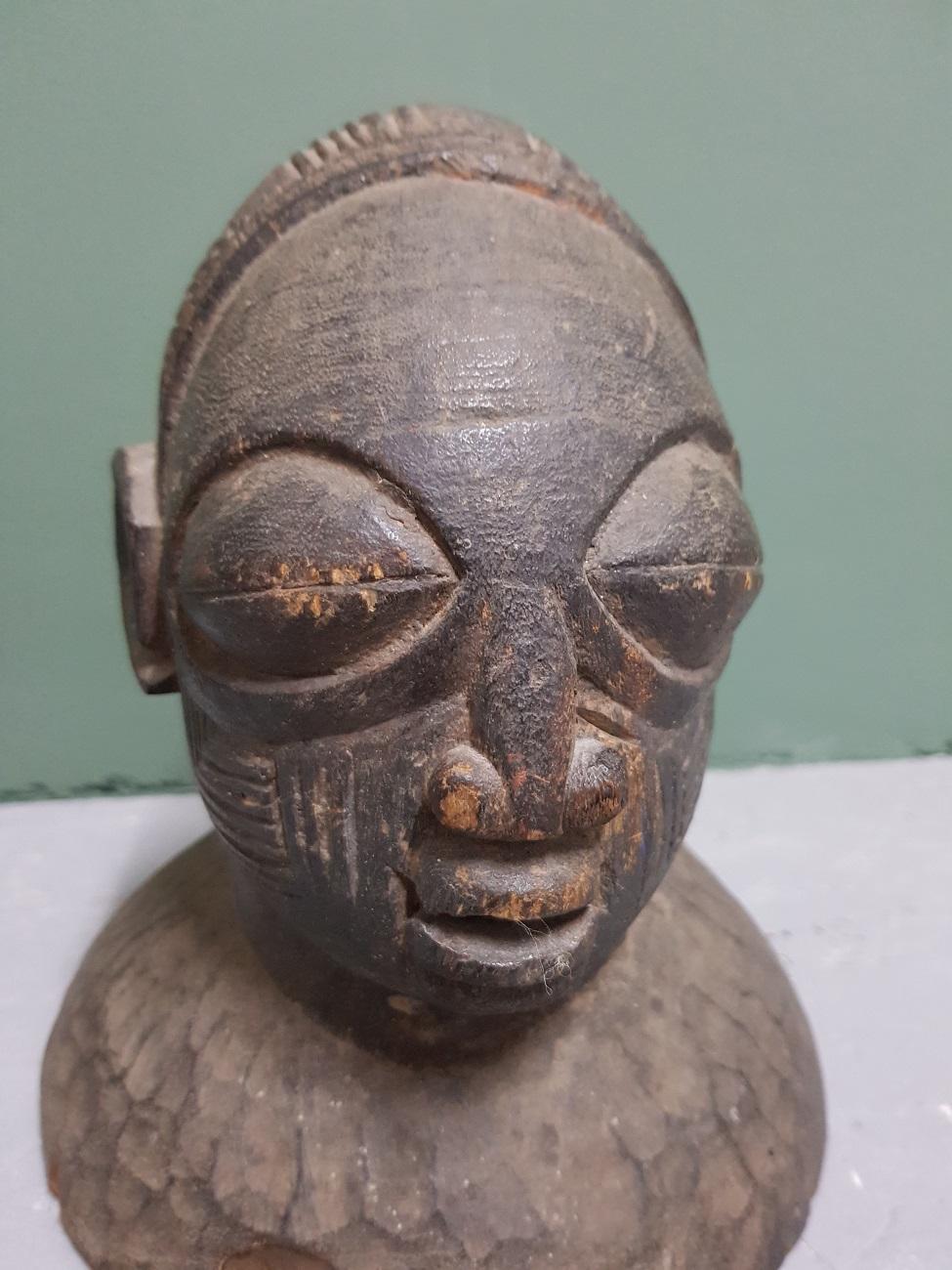 A hand carved wooden head mask for dances in honour of ‘Egungun’, the god of ancestors, from the Yoruba tribe of Nigeria first half of the 20th century.

The measurements are,
Depth 19 cm/ 7.4 inch.
Width 19.5 cm/ 7.6 inch.
Height 22 cm/ 8.6