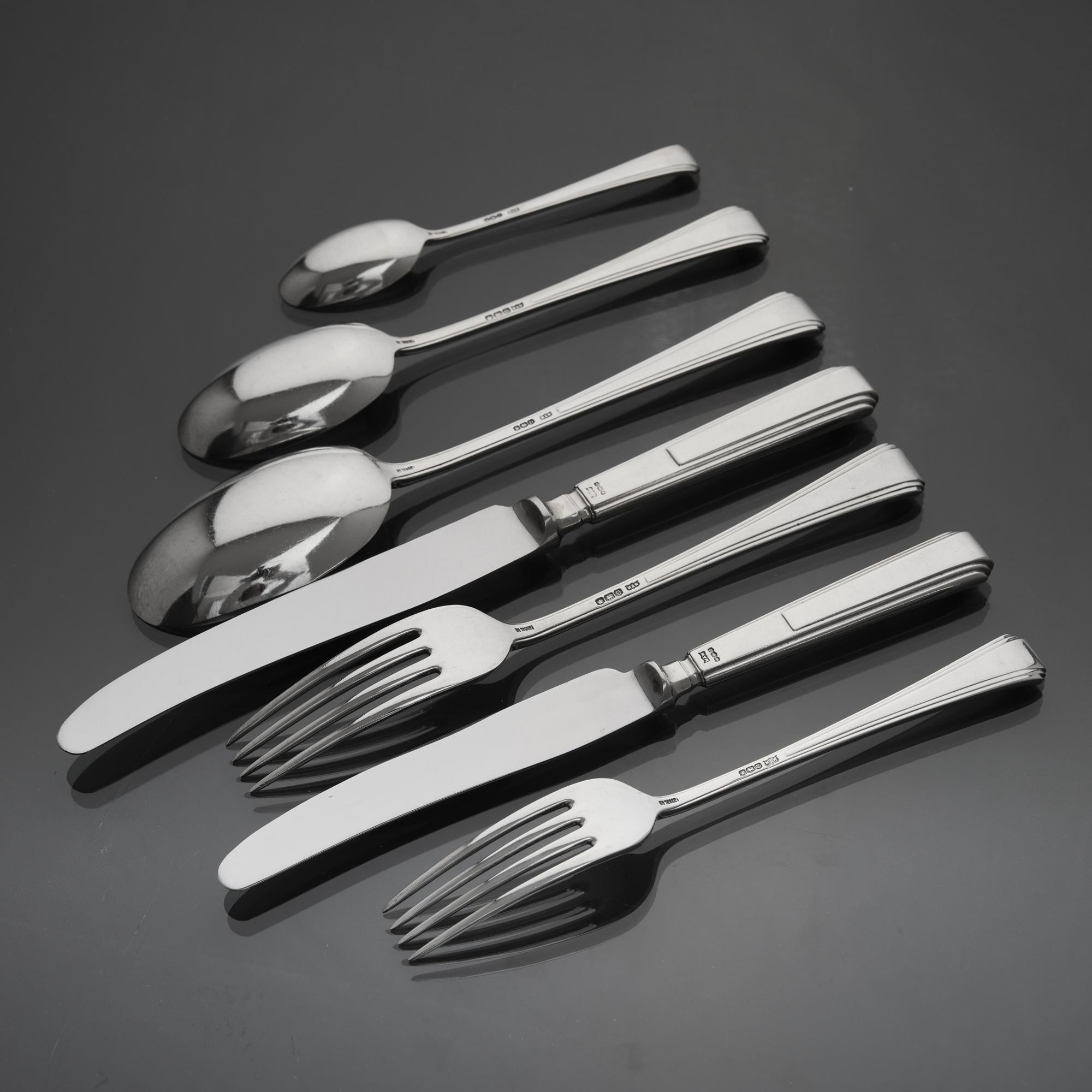 Extensive set of George VI silver flatware in the Tudor pattern, featuring stepped Art Deco style terminals; a characteristic design motif of the Art Deco era.
 
 With all pieces made by Mappin and Webb and presented in the original fitted oak