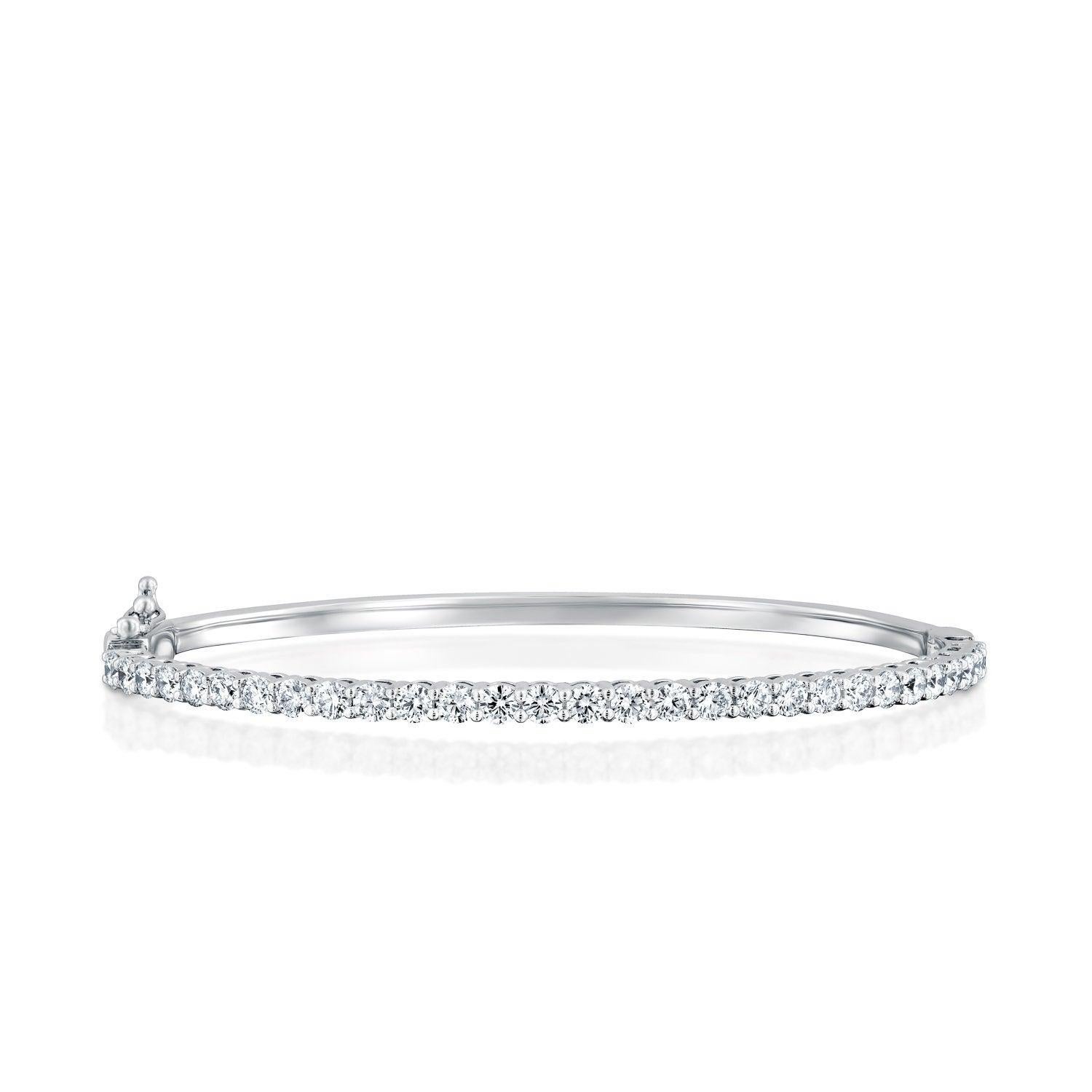 A beautiful large and classic diamond bracelet made of 14K White Gold set with 29 diamonds. The total carat weight of this beautiful Diamond bracelet is 2 1/2 carat, D-F color and VS clarity. 
 
Metal Type: 
This bracelet can be made in yellow gold,