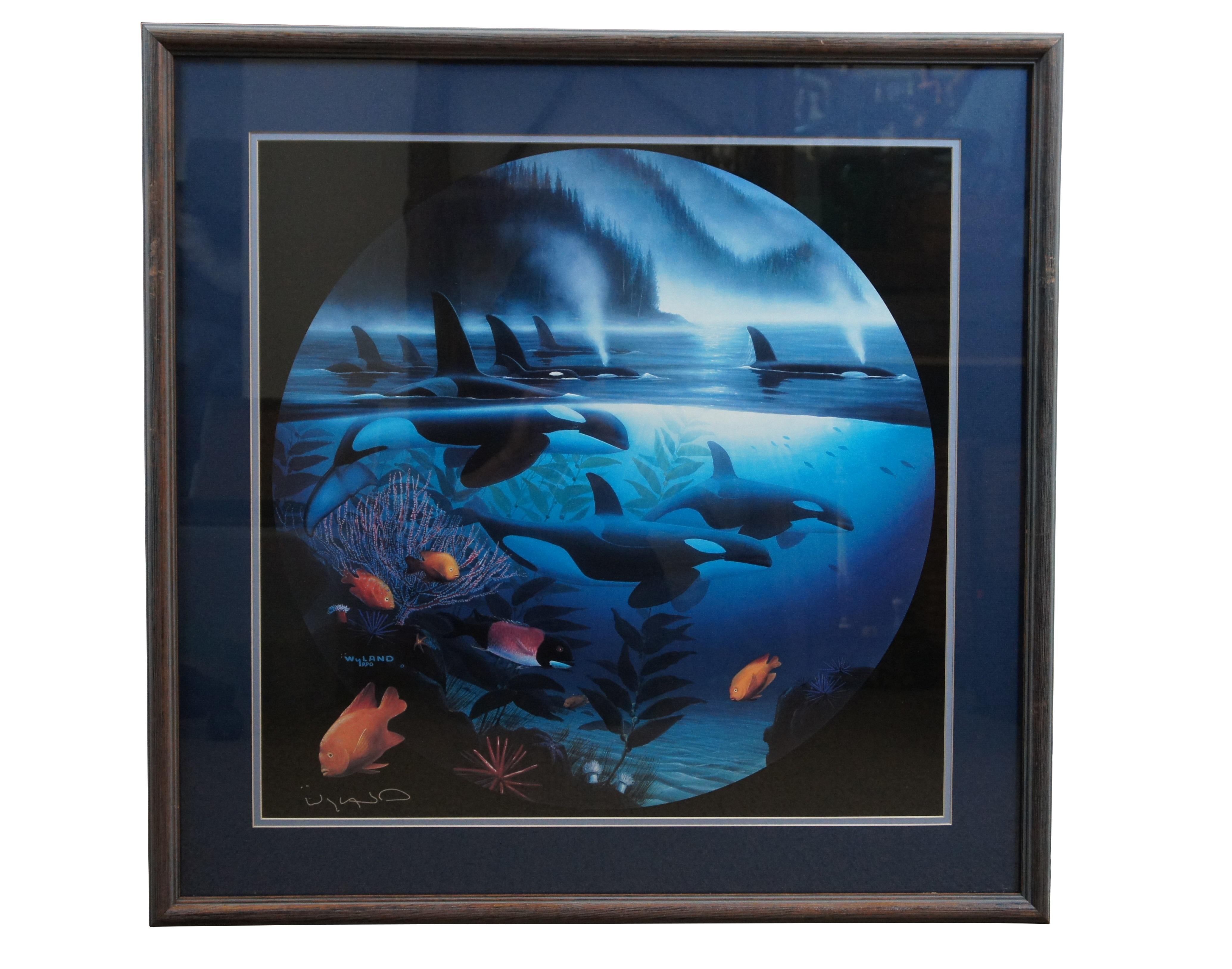 Pair of early 1990's lithograph prints by Robert Wyland - Orca Journey and Sea Otters. Both signed in metallic pen. Framed in factory distressed wood frames with blue matt under glass.

