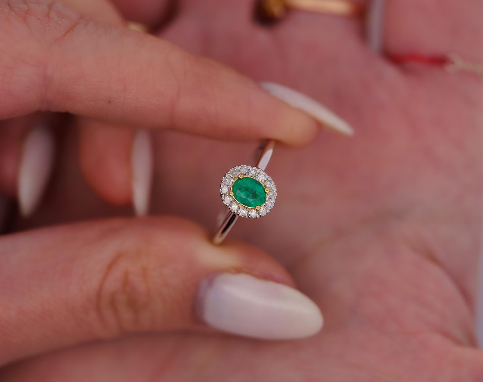 Natural Oval Cut Emerald and Diamond Halo Ring, Set in 18K Solid White Gold. The perfect natural gemstone emerald ring that won't break the bank.

Featuring a rich oval cut green natural Emerald and round cut diamond side stones that form a halo.