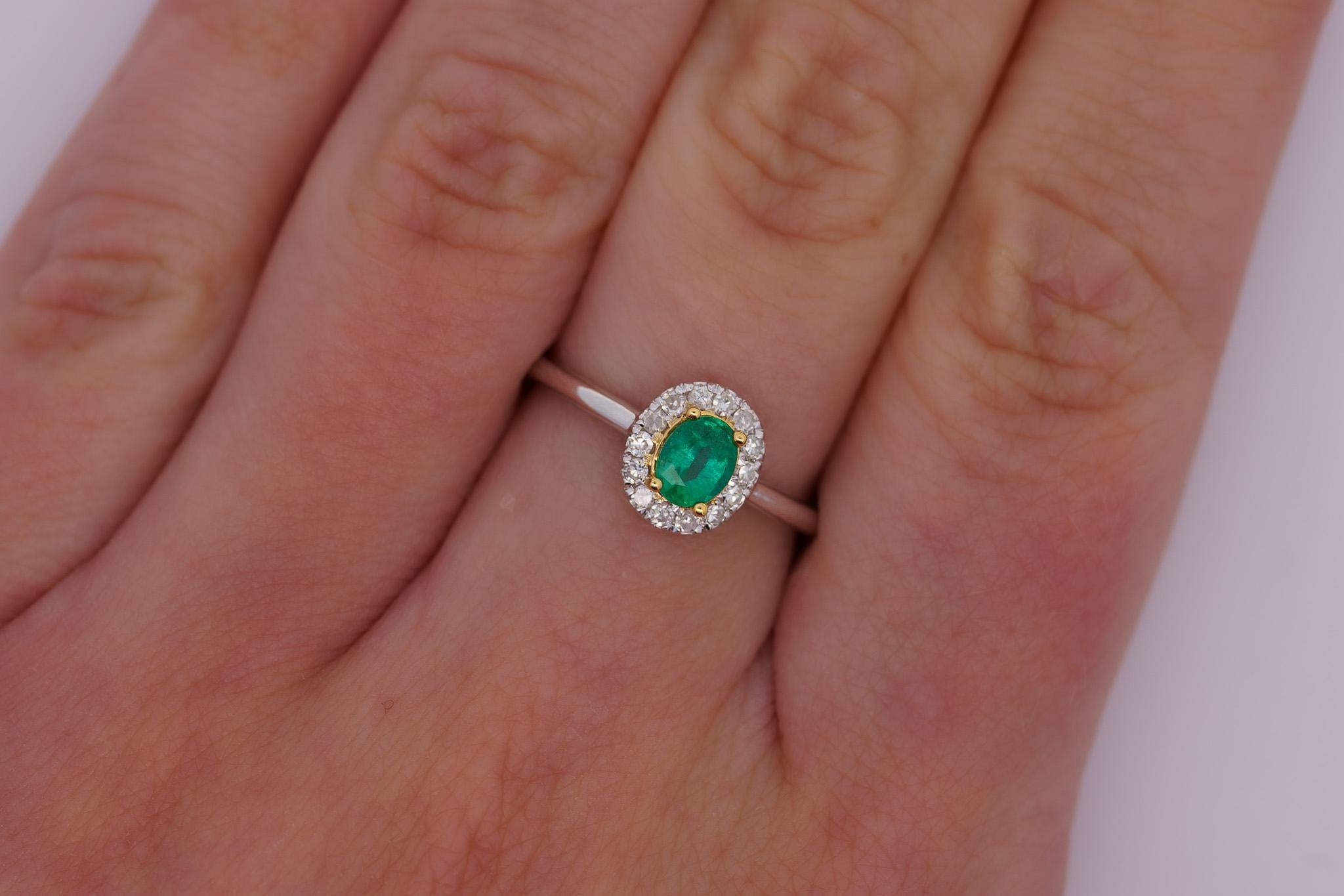 Modern 2/3 Carat Natural Emerald & Diamond Oval Halo 1.7mm Band Ring in 18K White Gold For Sale