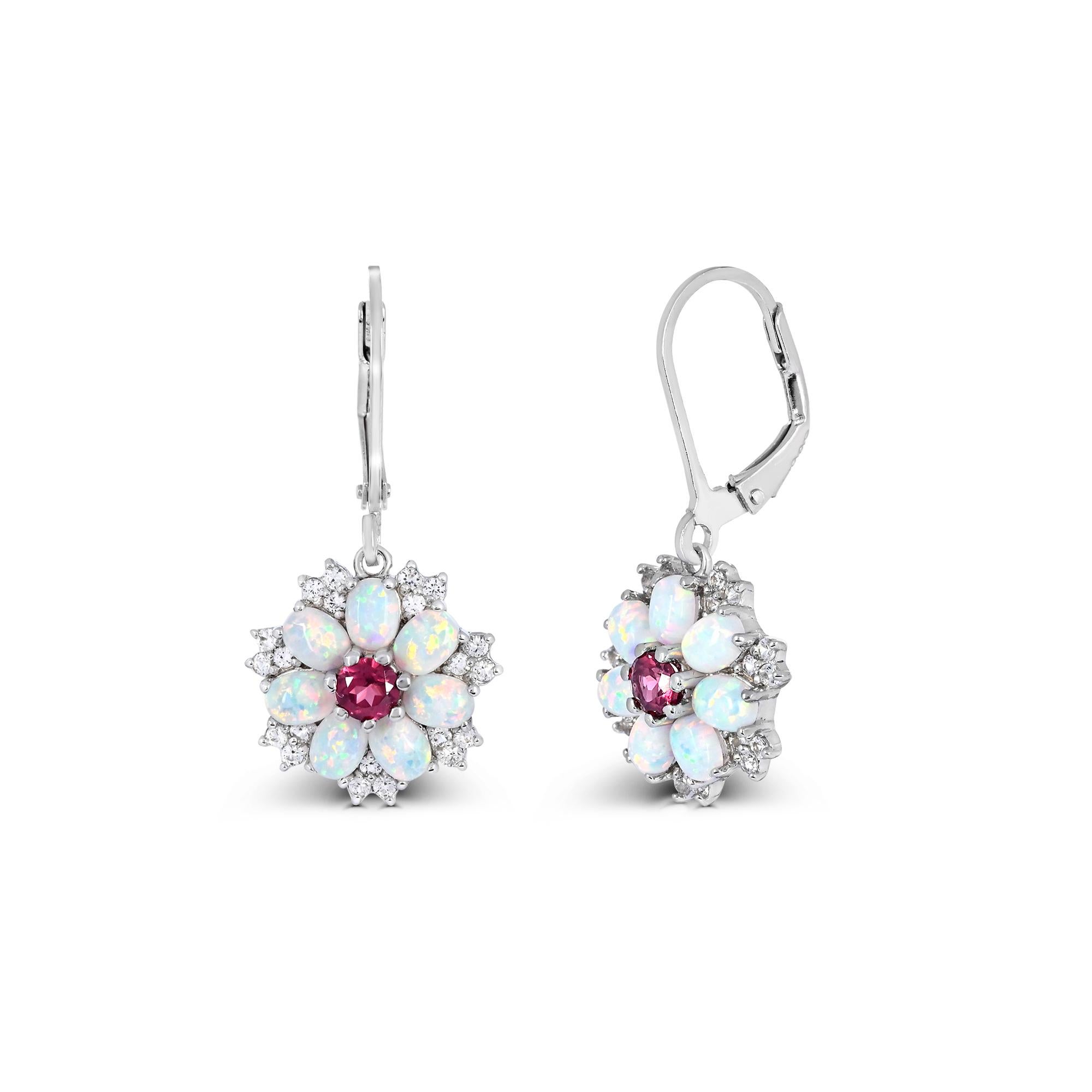 Indulge in the charm of our floral earrings in sterling silver. Crafted with meticulous attention to detail, these earrings boast a stunning combination of rhodolite garnet accented by oval created opal. The sparkling round created white sapphire