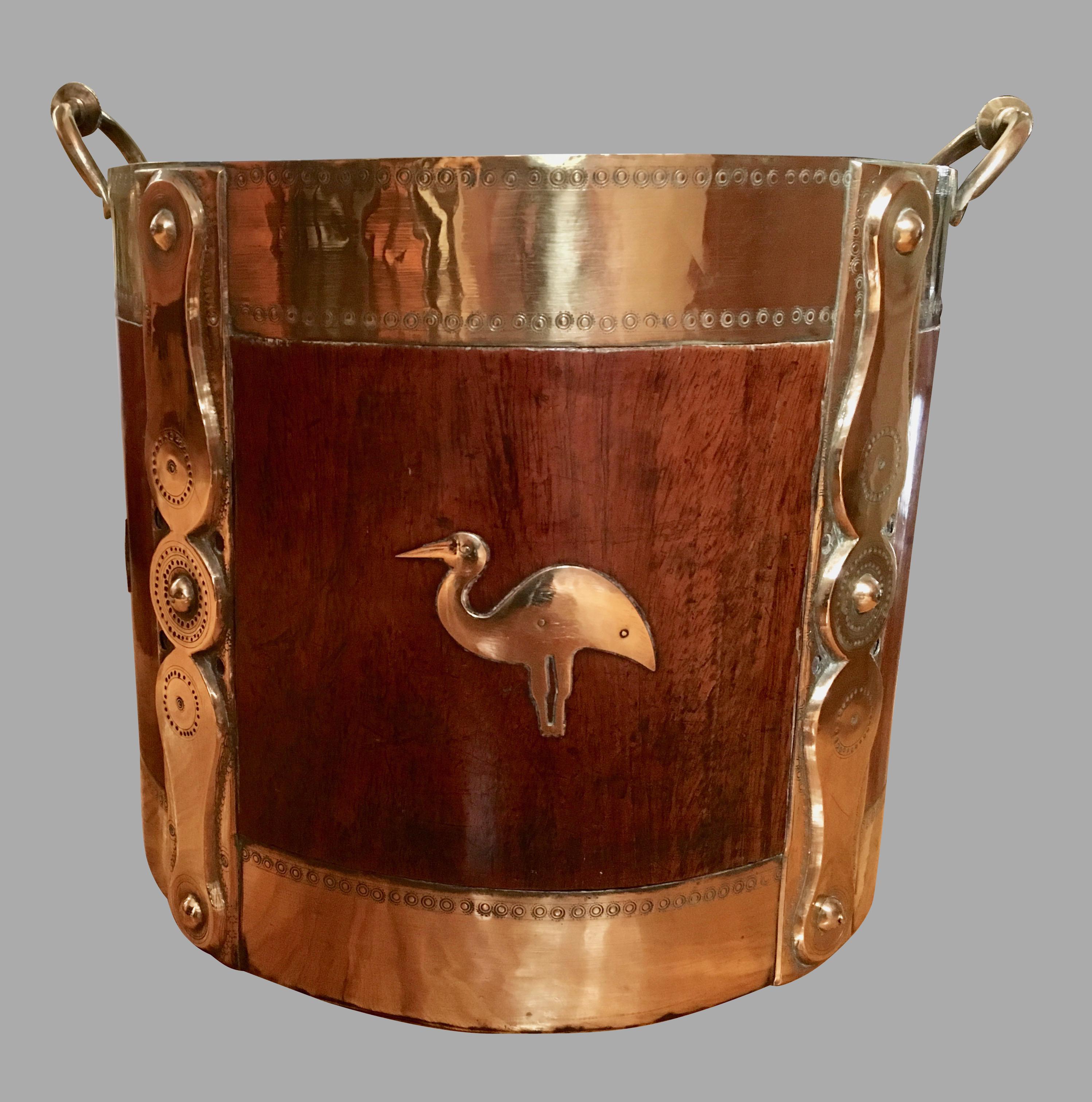 A rare pair of Anglo-Indian hardwood brass-mounted buckets with later metal inserts, the exterior decorated with cut brass applied fish, bird and lizard mounts, further decorated with vertical banding and brass carrying handles. 19th century.