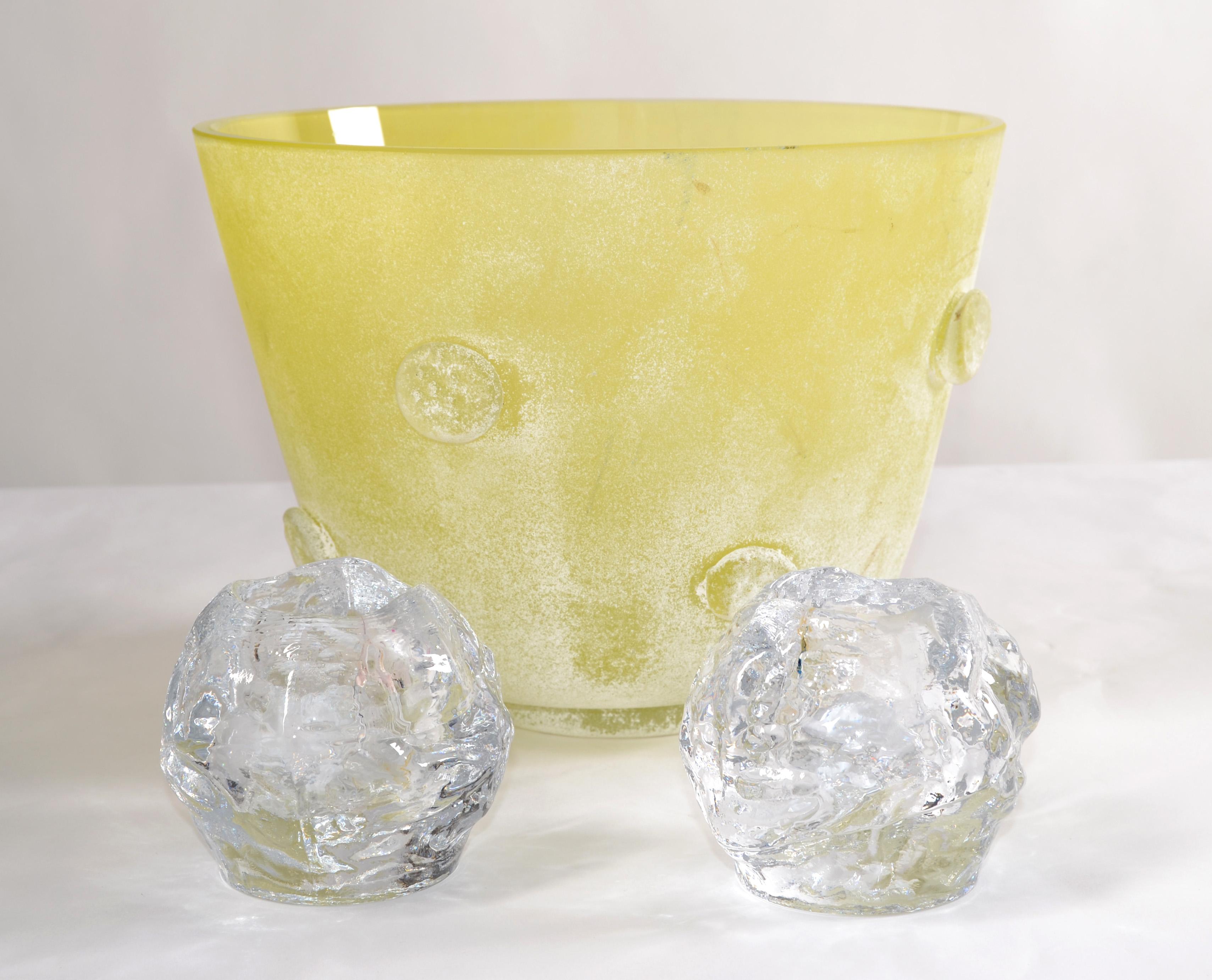 This is a set of 2 vintage 1970's Kosta Boda Snowball Candle Holders styled after Goran and Ann Warff attributed to Kosta Boda, Sweden.  
Crafted out of heavyweight, lead-free, clear crystal.
Scandinavian Modern Design made in a texture that seem to