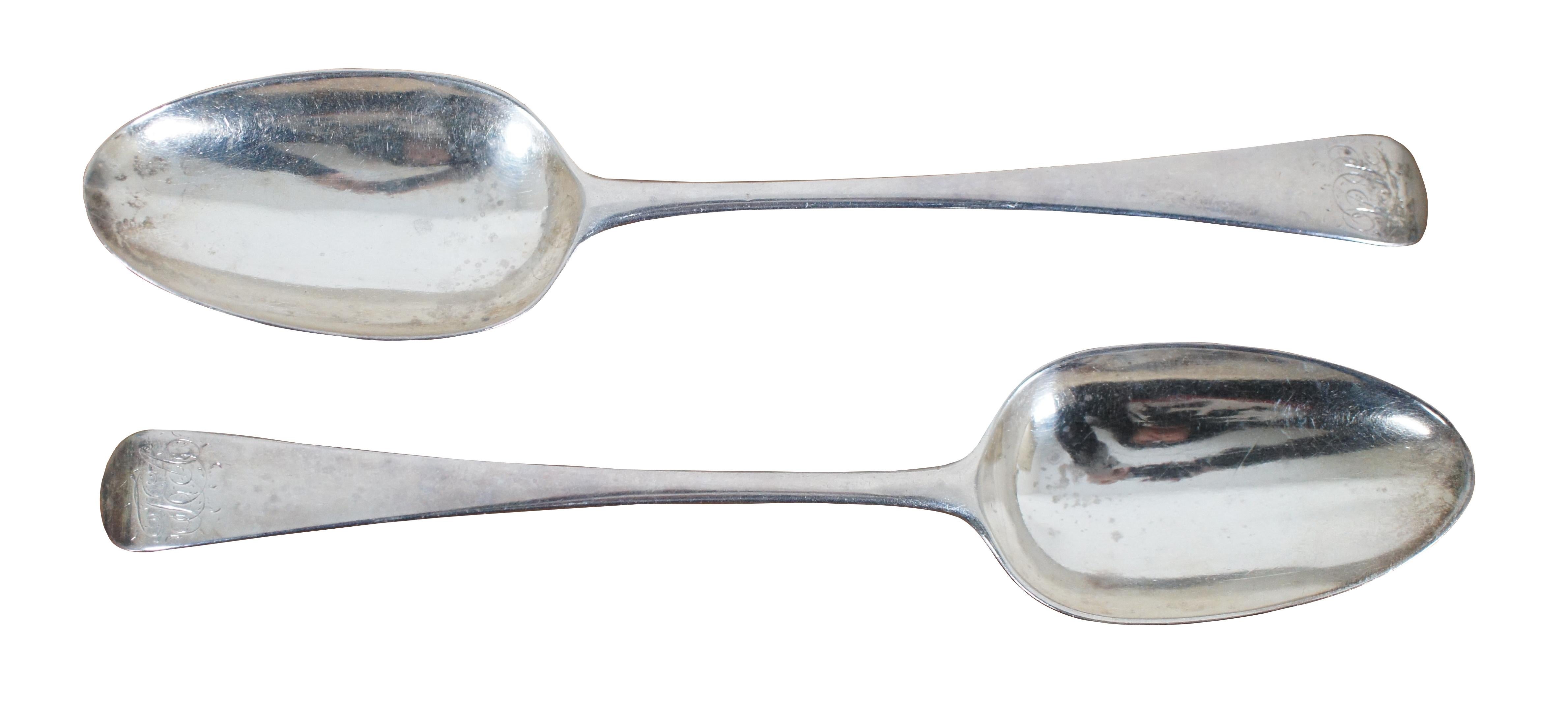 Pair of large heavy antique late 18th century Georgian sterling silver serving spoons with tipped handles, monogrammed with the initials TA. Made in 1780 by George Smith III of London England.

