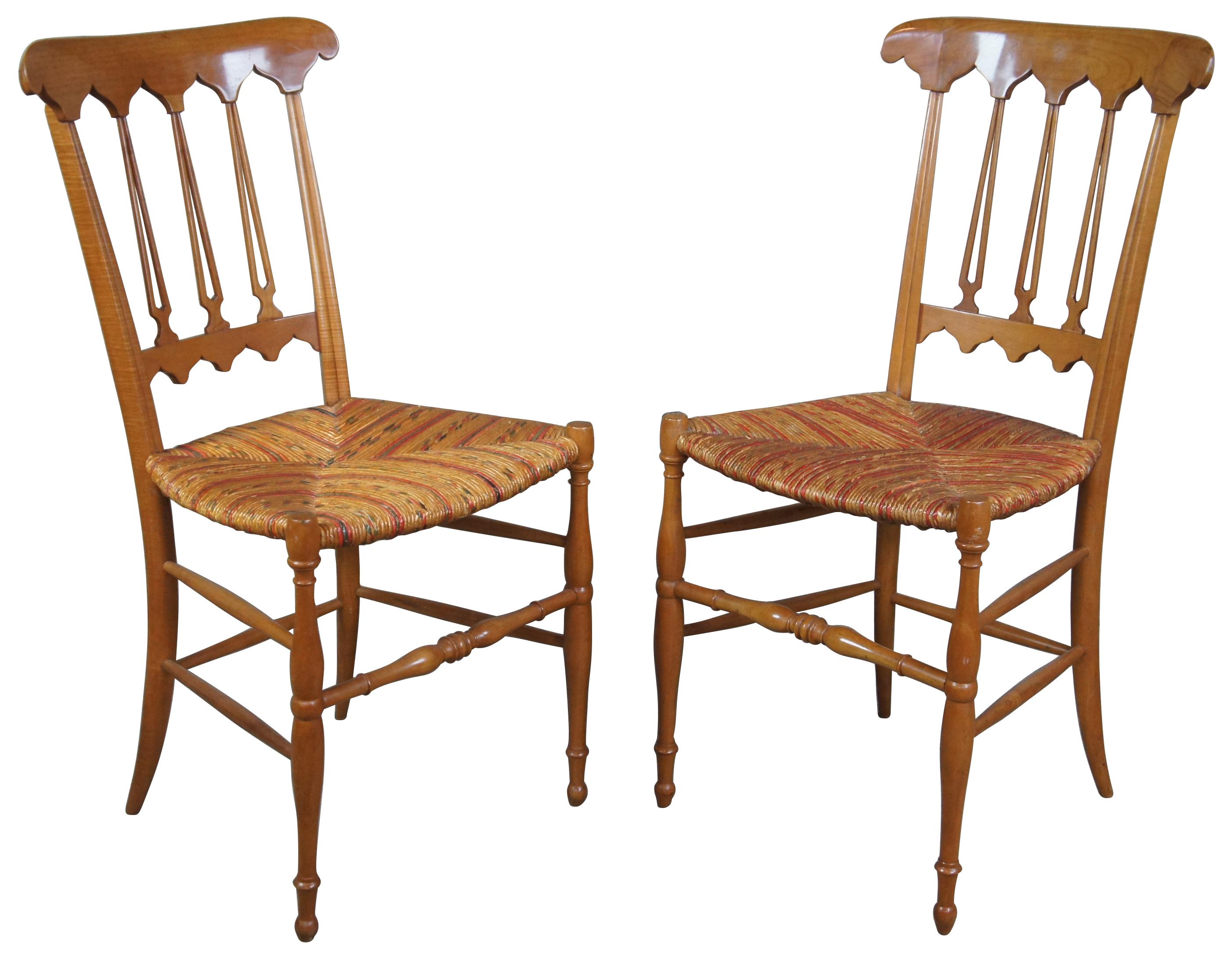 Pair of two Italian Chiavari Biedermeier parlor chairs. Made from solid maple with a shaped back and Gothic style arcade design leading to split spindles. Seats covered in multi-color wicker pattern.