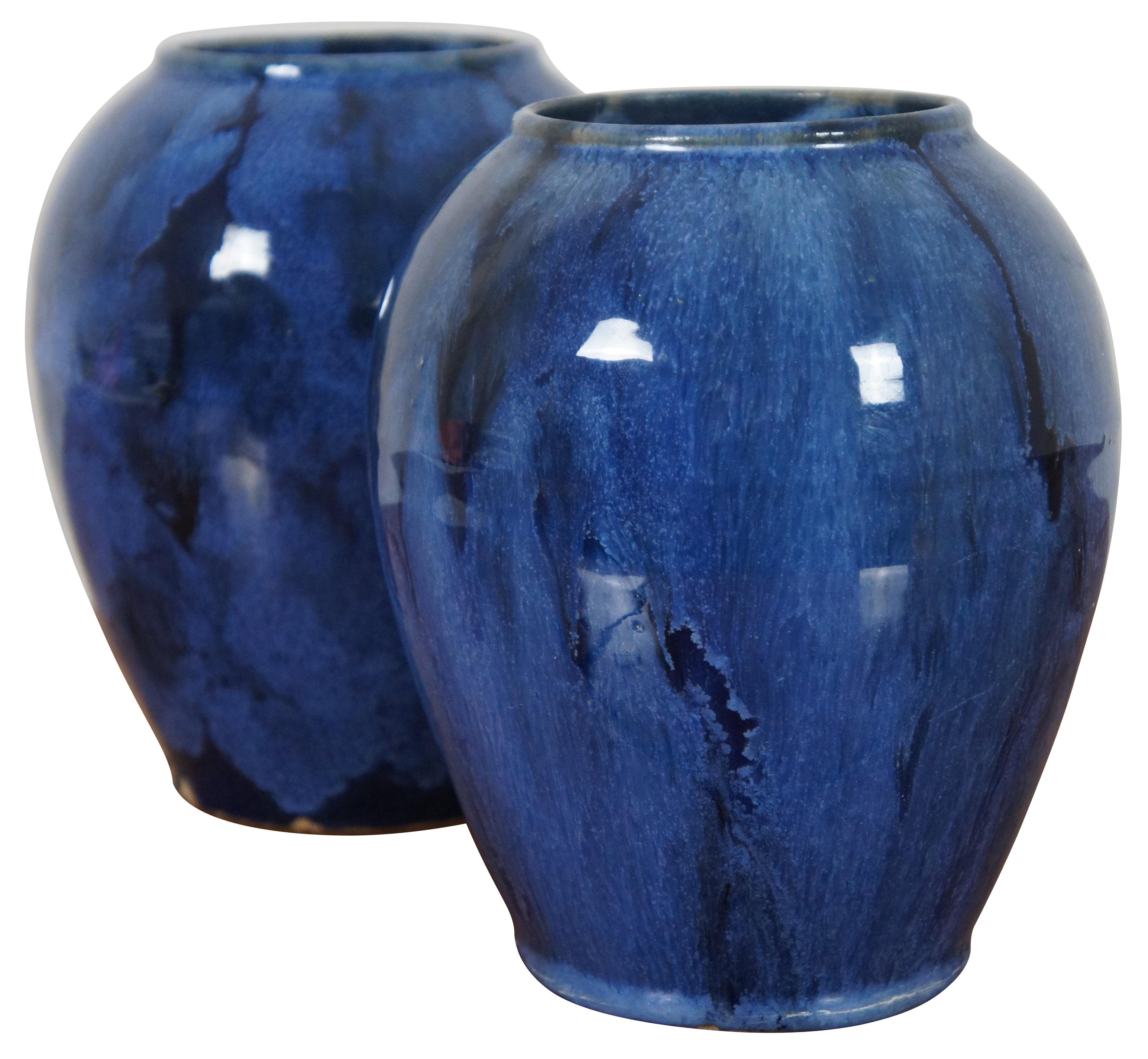 Pair of antique circa 1924 vases, attributed to Brush-McCoy in their iconic Blue Onyx glaze.

“In 1848, J.W. McCoy was born and raised in Putnam, which is now part of Zanesville, Ohio. He was married in 1870, and the next year he and Sarah (Sade)