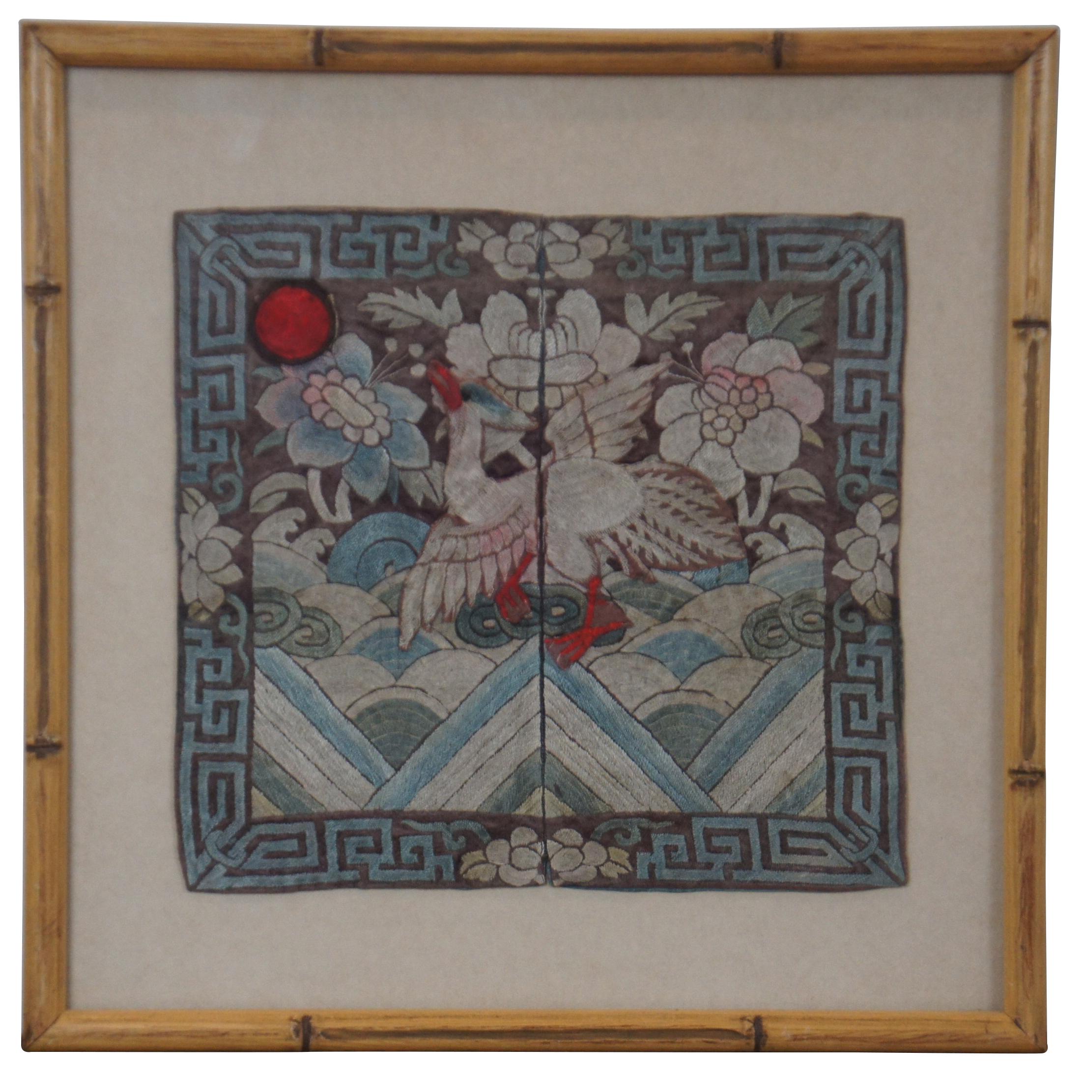 Pair of antique Chinese Qing Dynasty silk textile / tapestry court rank military buzi badges or panels embroidered with a scene of a dancing Manchurian Crane / bird in front of flowers, looking towards a red sun. Framed in faux bamboo.

A mandarin