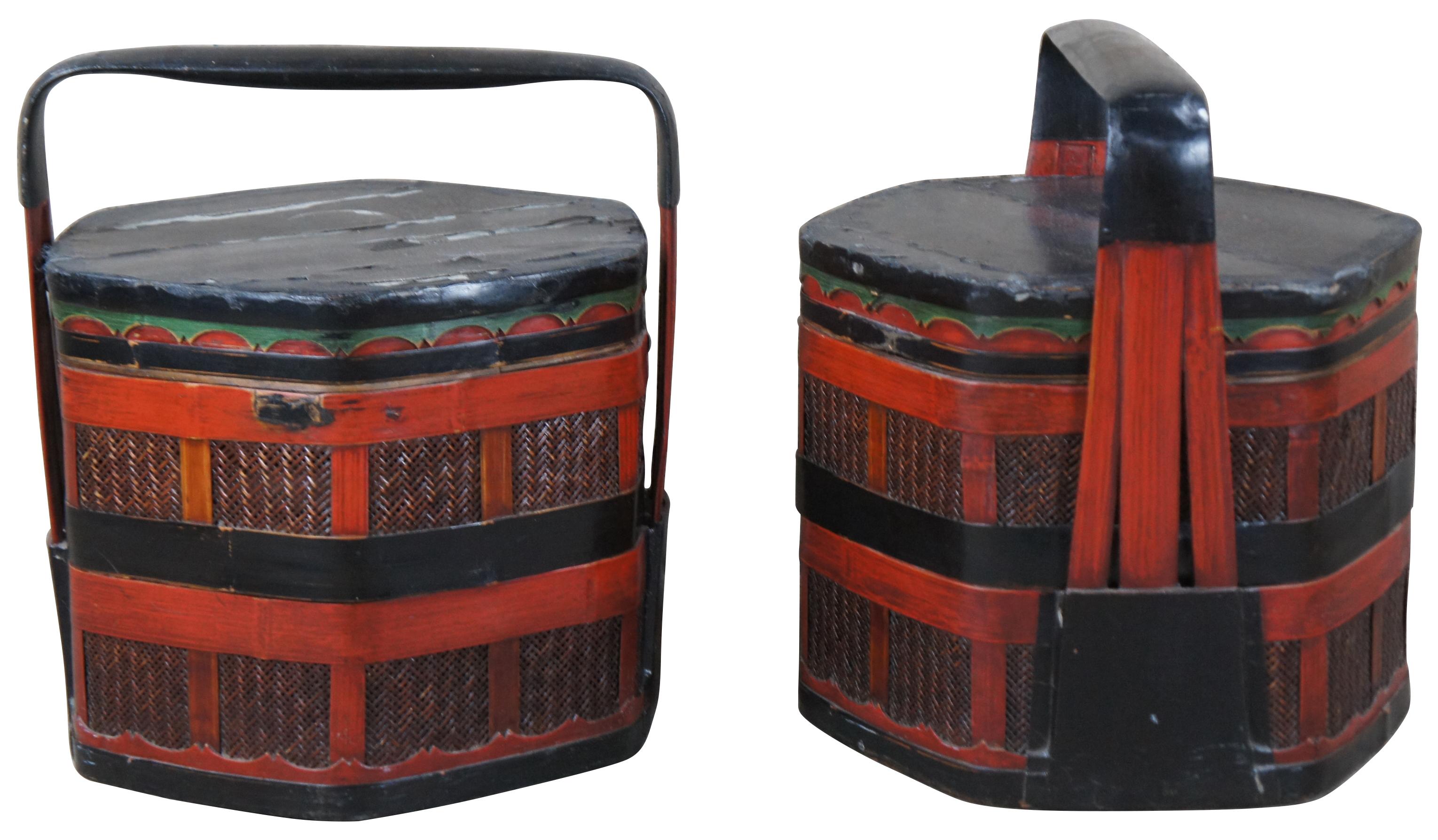 An impressive pair of antique Chinese two tiered hexagon shaped wedding basket or box. Made of lacquered bamboo and rattan. Hand painted in red and black with green accents. 

Written cursive script translates to poems about 