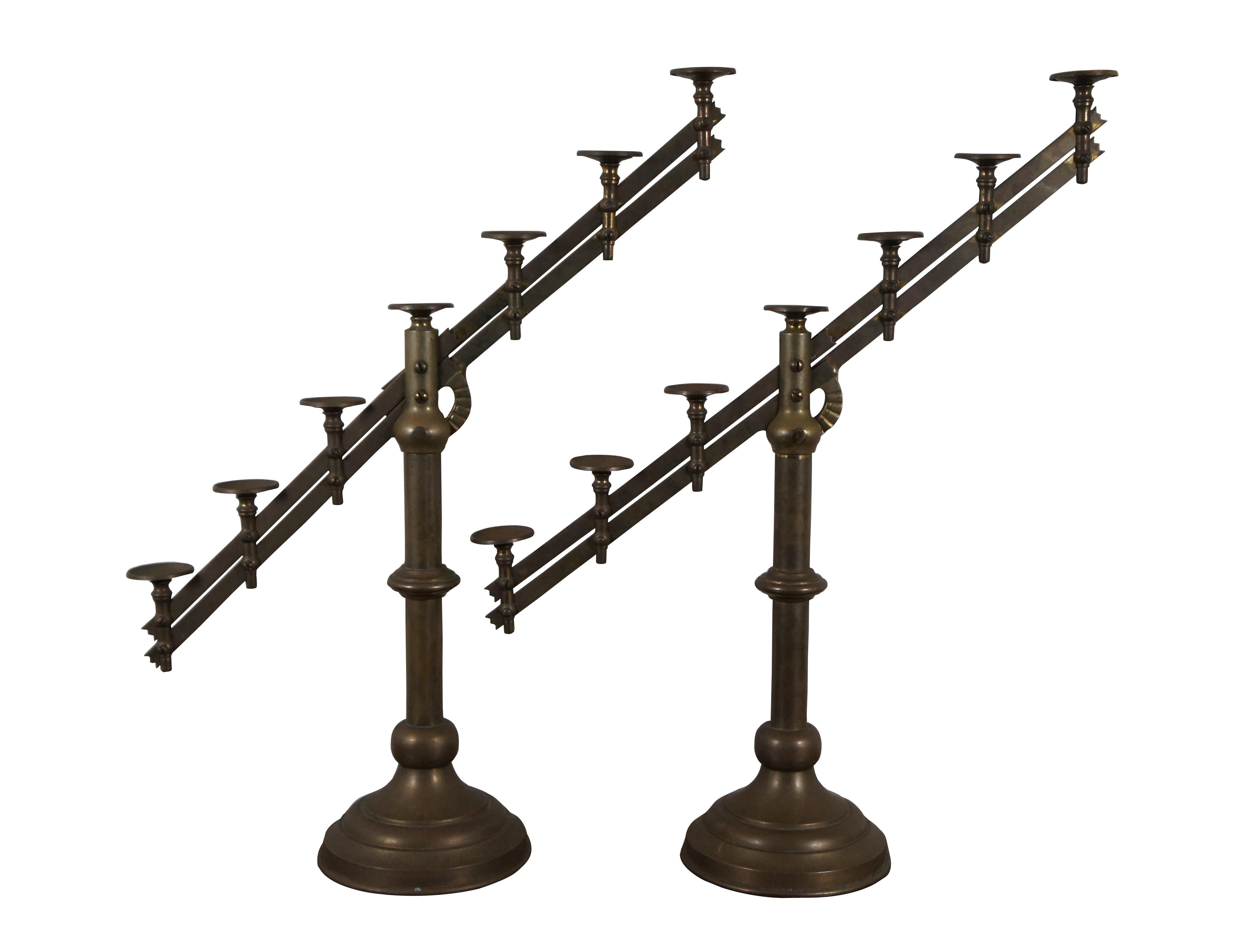 Late 19th century pair of brass seven light candelabras - church / temple / altar candlesticks - with rotating adjustable / articulating arms.

Dimensions:
7.25