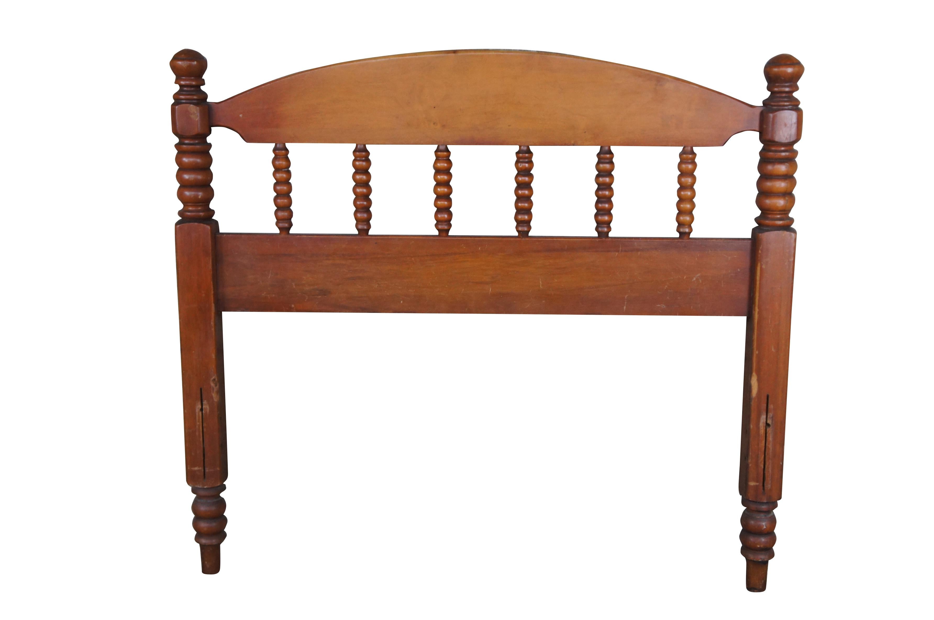 Pair of Early American style twin size headboards.  Made from maple with a crescent shaped back with ribbed spindles and turned posts.

Dimensions:
38